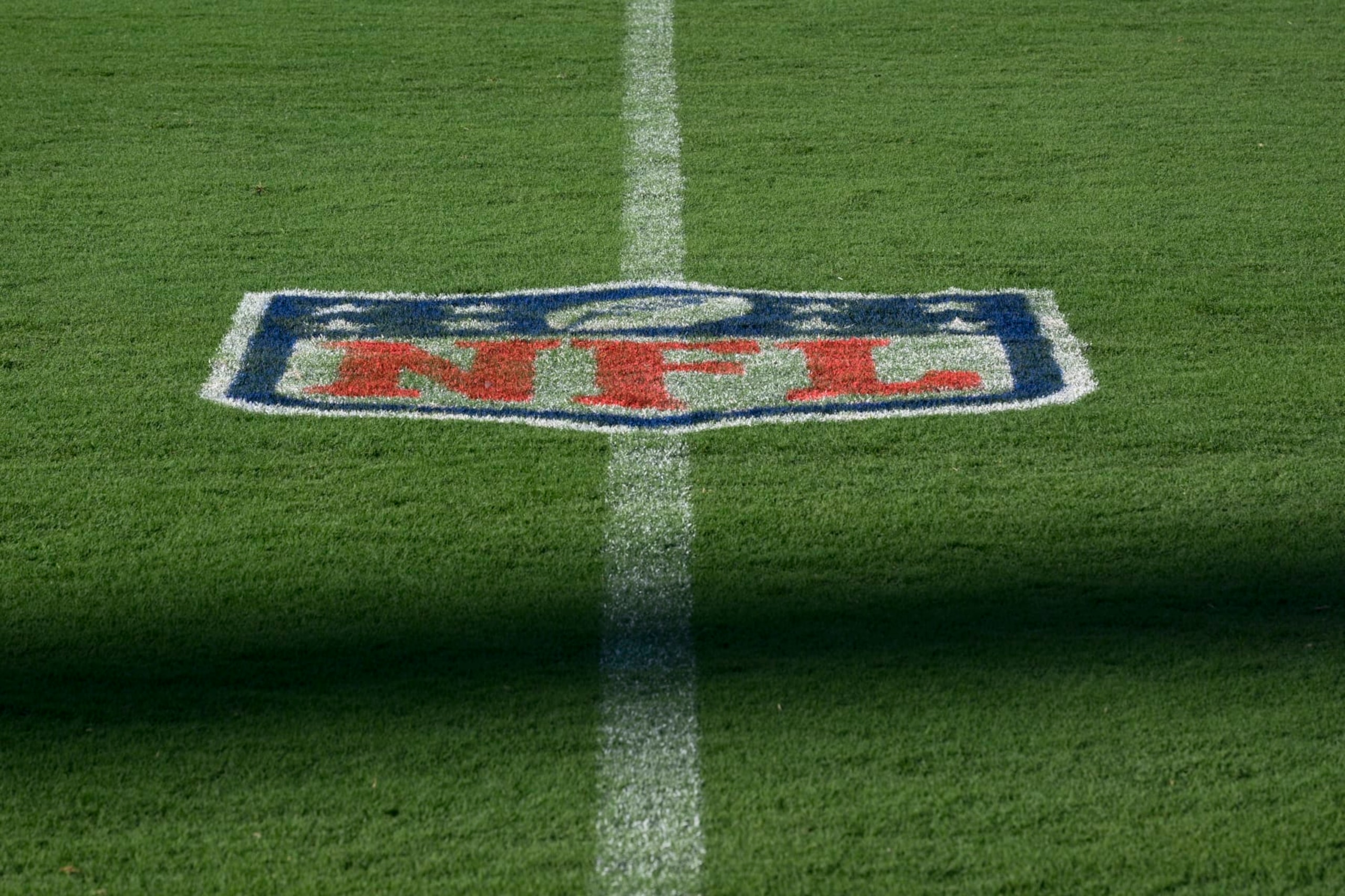 The NFL logo is seen on the field at M&T Bank Stadium prior to an NFL football game between the Baltimore Ravens and the Tennessee Titans, Thursday, Aug. 11, 2022, in Baltimore. (AP Photo/Nick Wass) The NFL logo is seen on the field at M&T Bank Stadium prior to an NFL football game between the Baltimore Ravens and the Tennessee Titans, Thursday, Aug. 11, 2022, in Baltimore. (AP Photo/Nick Wass)