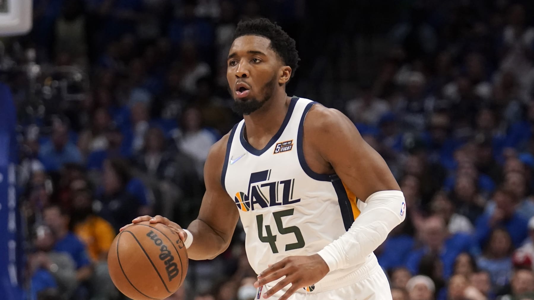 Utah Jazz's Donovan Mitchell (45) works against the Dallas Mavericks in Game 5 of an NBA basketball first-round playoff series, Monday, April 25, 2022, in Dallas. (AP Photo/Tony Gutierrez)