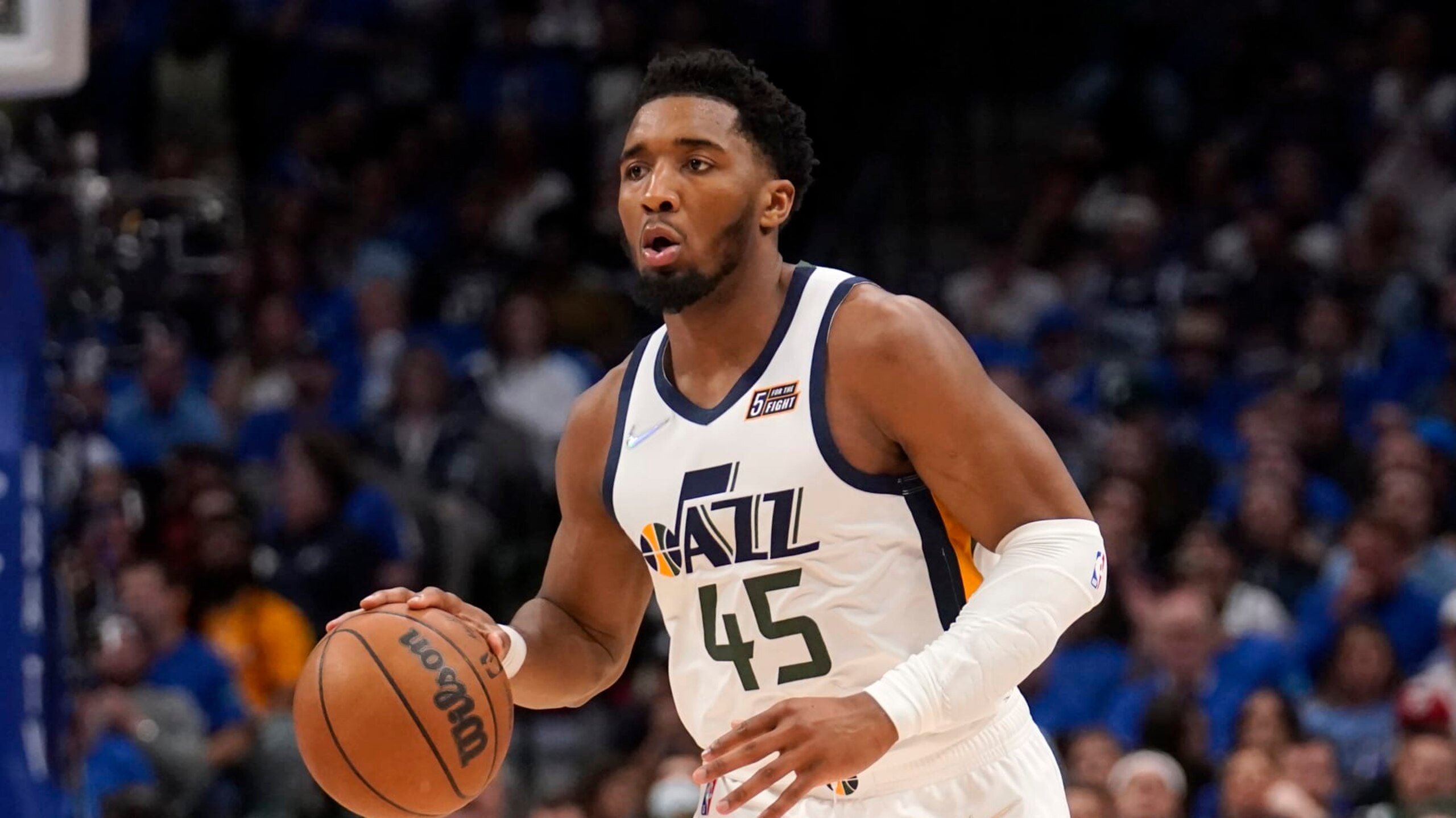 Utah Jazz's Donovan Mitchell (45) works against the Dallas Mavericks in Game 5 of an NBA basketball first-round playoff series, Monday, April 25, 2022, in Dallas. (AP Photo/Tony Gutierrez)