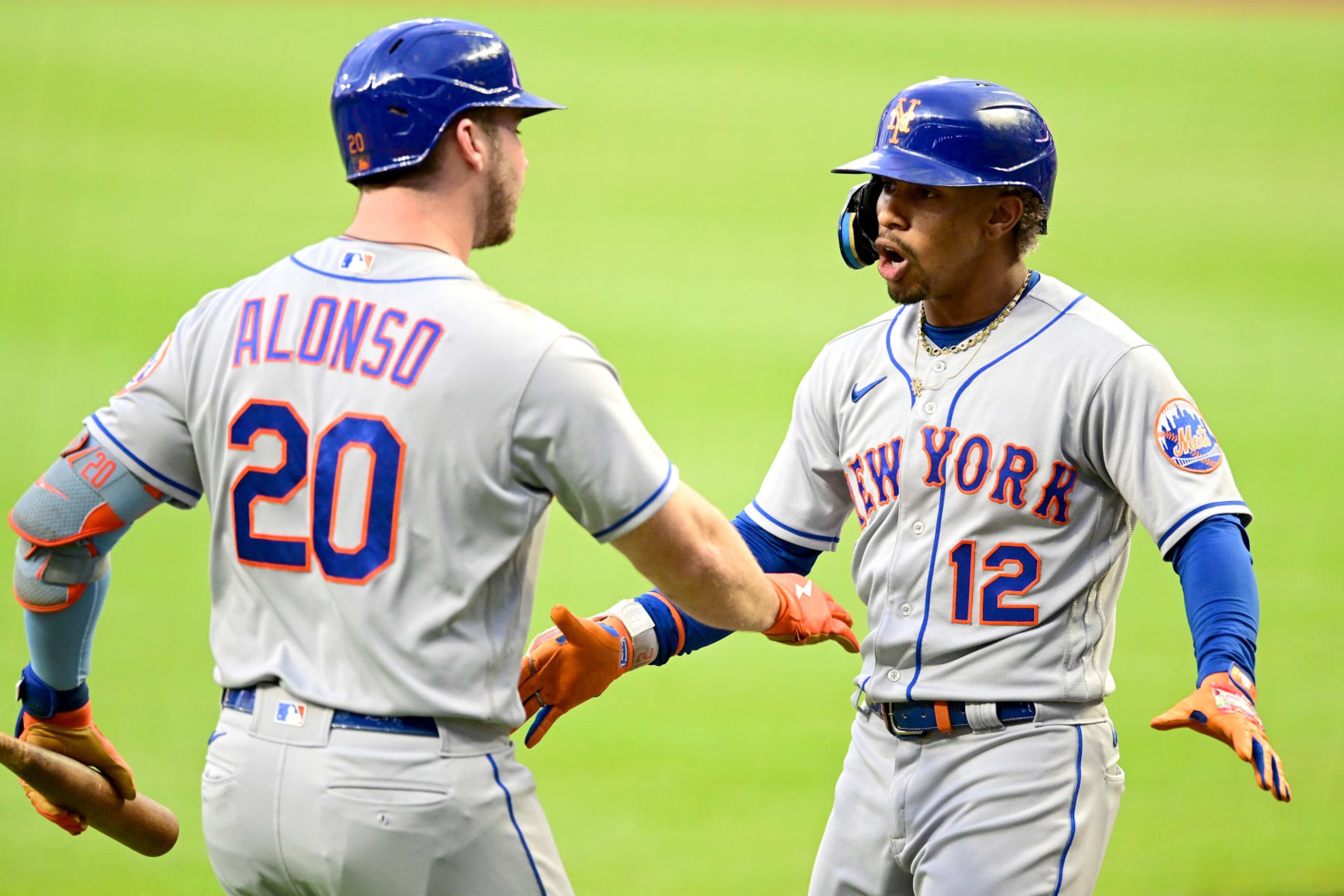 ATLANTA, GA - AUGUST 17: Francisco Lindor #12 of the New York Mets celebrates with Pete Alonso #20 of the New York Mets after hitting a home run during the first inning against the Atlanta Braves at Truist Park on August 17, 2022 in Atlanta, Georgia. (Photo by Adam Hagy/Getty Images)