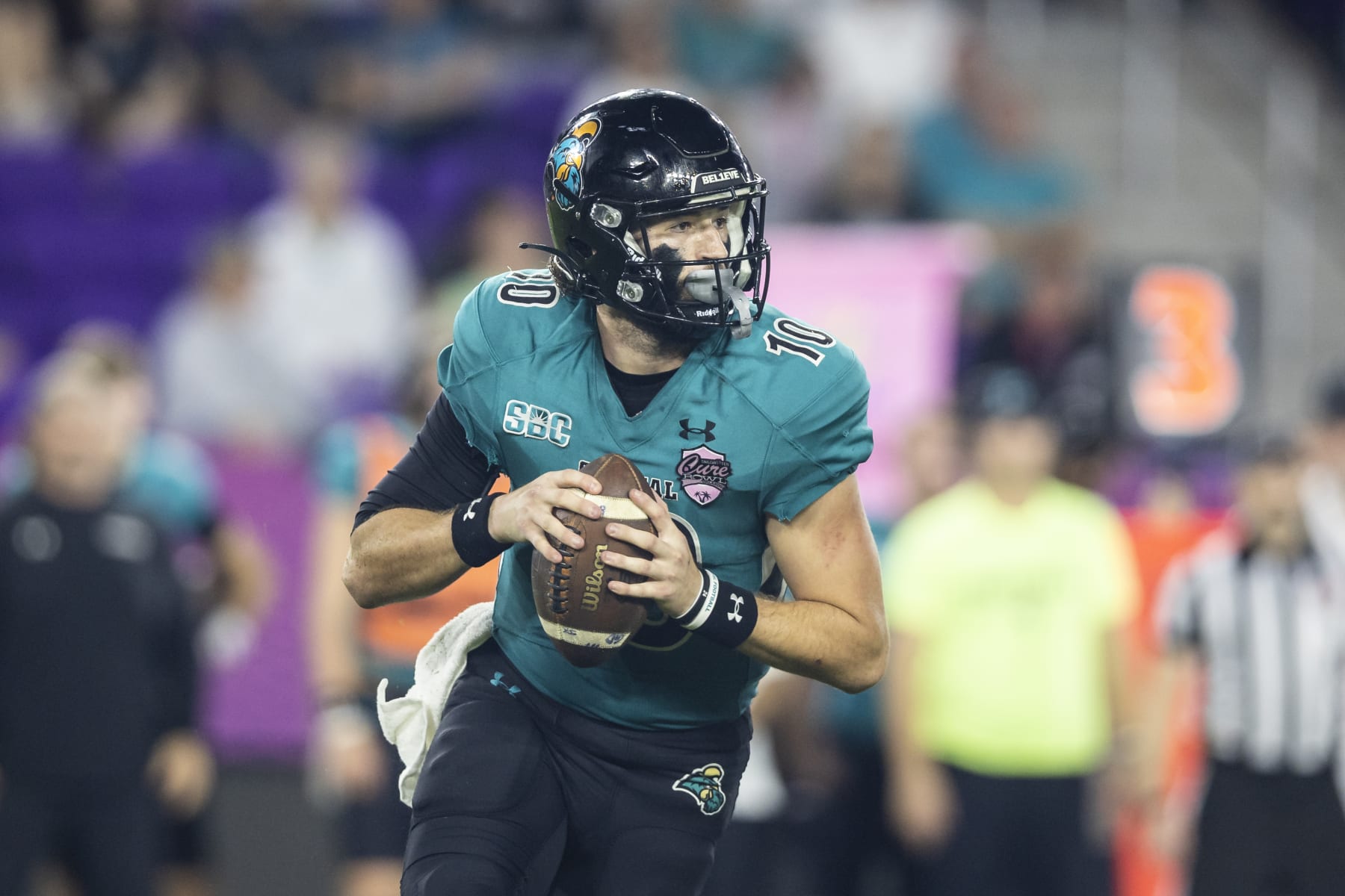 ORLANDO, FLORIDA - DECEMBER 17: Grayson McCall #10 of the Coastal Carolina Chanticleers looks to pass during the second half of the 2021 Cure Bowl against the Northern Illinois Huskies at Exploria Stadium on December 17, 2021 in Orlando, Florida. (Photo by James Gilbert/Getty Images)