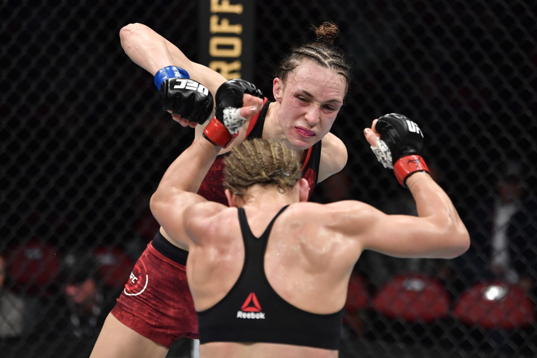 RALEIGH, NORTH CAROLINA - JANUARY 25:  (L-R) Lucie Pudilova of Czech Republic punches Justine Kish in their women's flyweight bout during the UFC Fight Night event at PNC Arena on January 25, 2020 in Raleigh, North Carolina. (Photo by Jeff Bottari/Zuffa LLC via Getty Images)