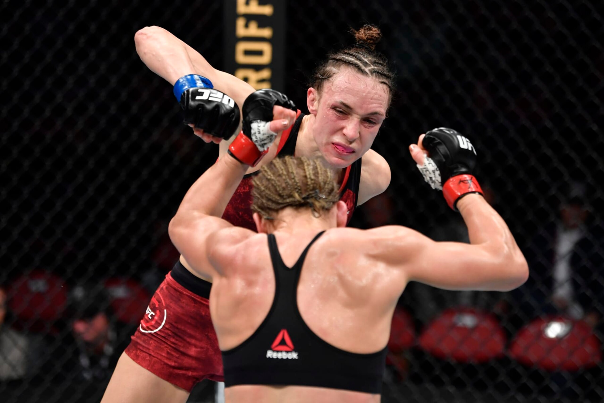 RALEIGH, NORTH CAROLINA - JANUARY 25:  (L-R) Lucie Pudilova of Czech Republic punches Justine Kish in their women's flyweight bout during the UFC Fight Night event at PNC Arena on January 25, 2020 in Raleigh, North Carolina. (Photo by Jeff Bottari/Zuffa LLC via Getty Images)