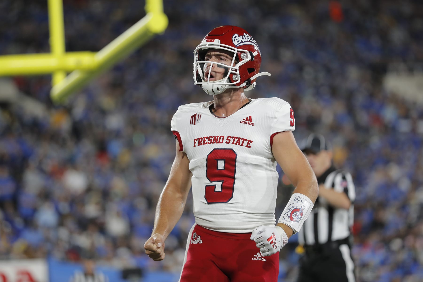 PASADENA, CALIFORNIA - SEPTEMBER 18: Jake Haener #9 of the Fresno State Bulldogs celebrates a touchdown against the UCLA Bruins during the second half at Rose Bowl on September 18, 2021 in Pasadena, California. (Photo by Michael Owens/Getty Images)