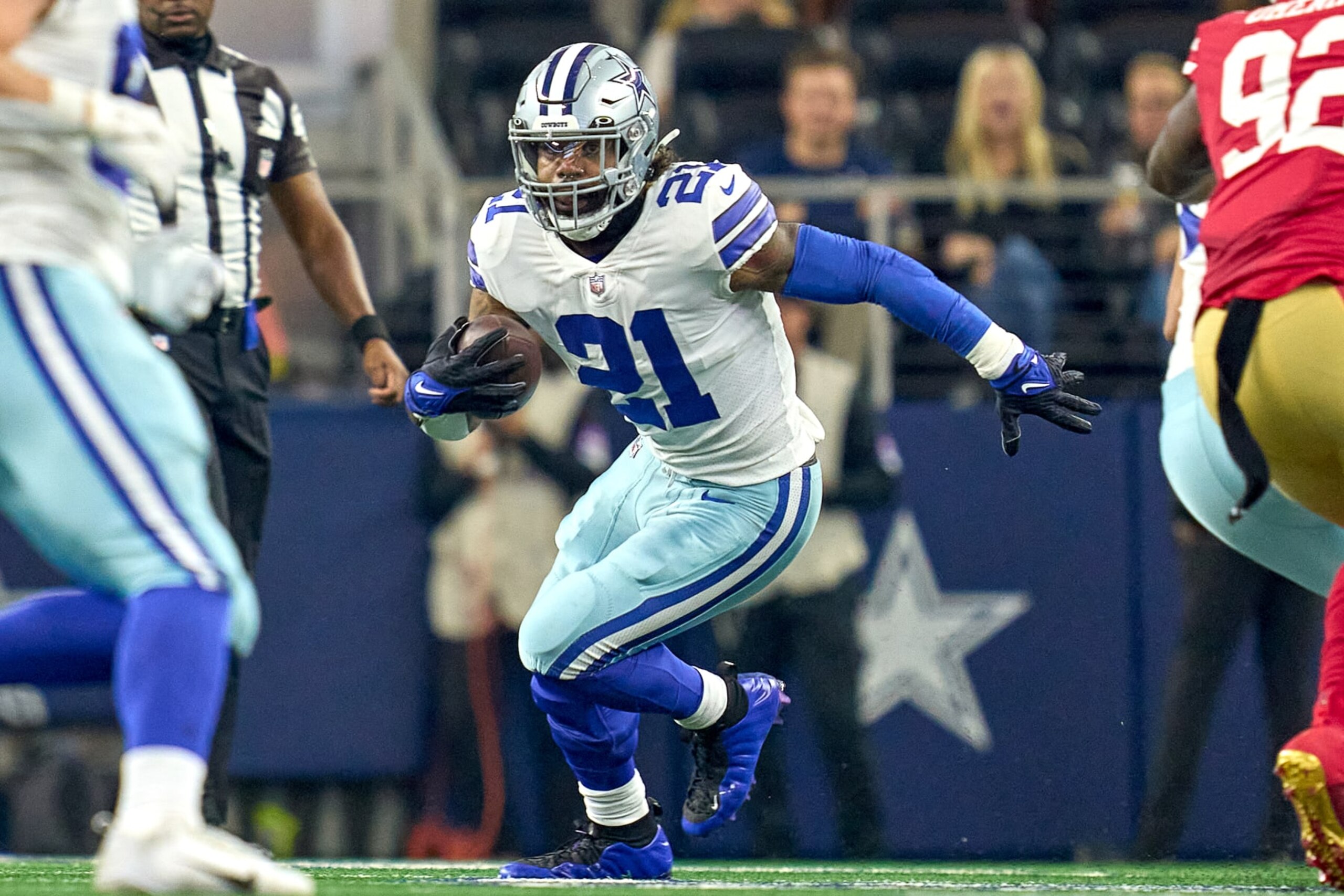 ARLINGTON, TX - JANUARY 16: Dallas Cowboys running back Ezekiel Elliott (21) runs with the football during the NFC Wild Card game between the San Francisco 49ers and the Dallas Cowboys on January 16, 2022 at AT&T Stadium in Arlington, TX. (Photo by Robin Alam/Icon Sportswire via Getty Images)