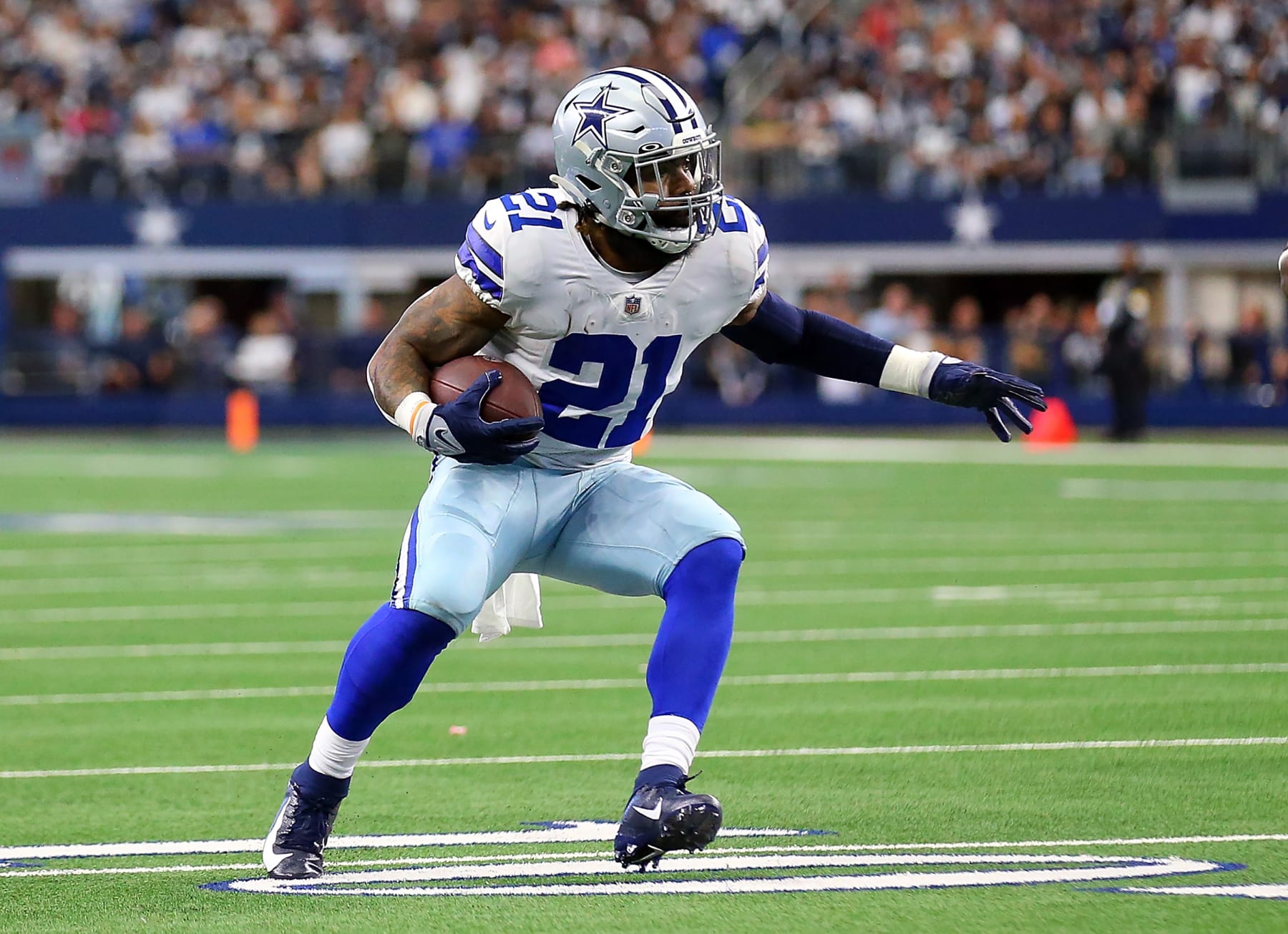 ARLINGTON, TEXAS - NOVEMBER 14: Ezekiel Elliott #21 of the Dallas Cowboys carries the ball against the Atlanta Falcons at AT&T Stadium on November 14, 2021 in Arlington, Texas. (Photo by Richard Rodriguez/Getty Images)