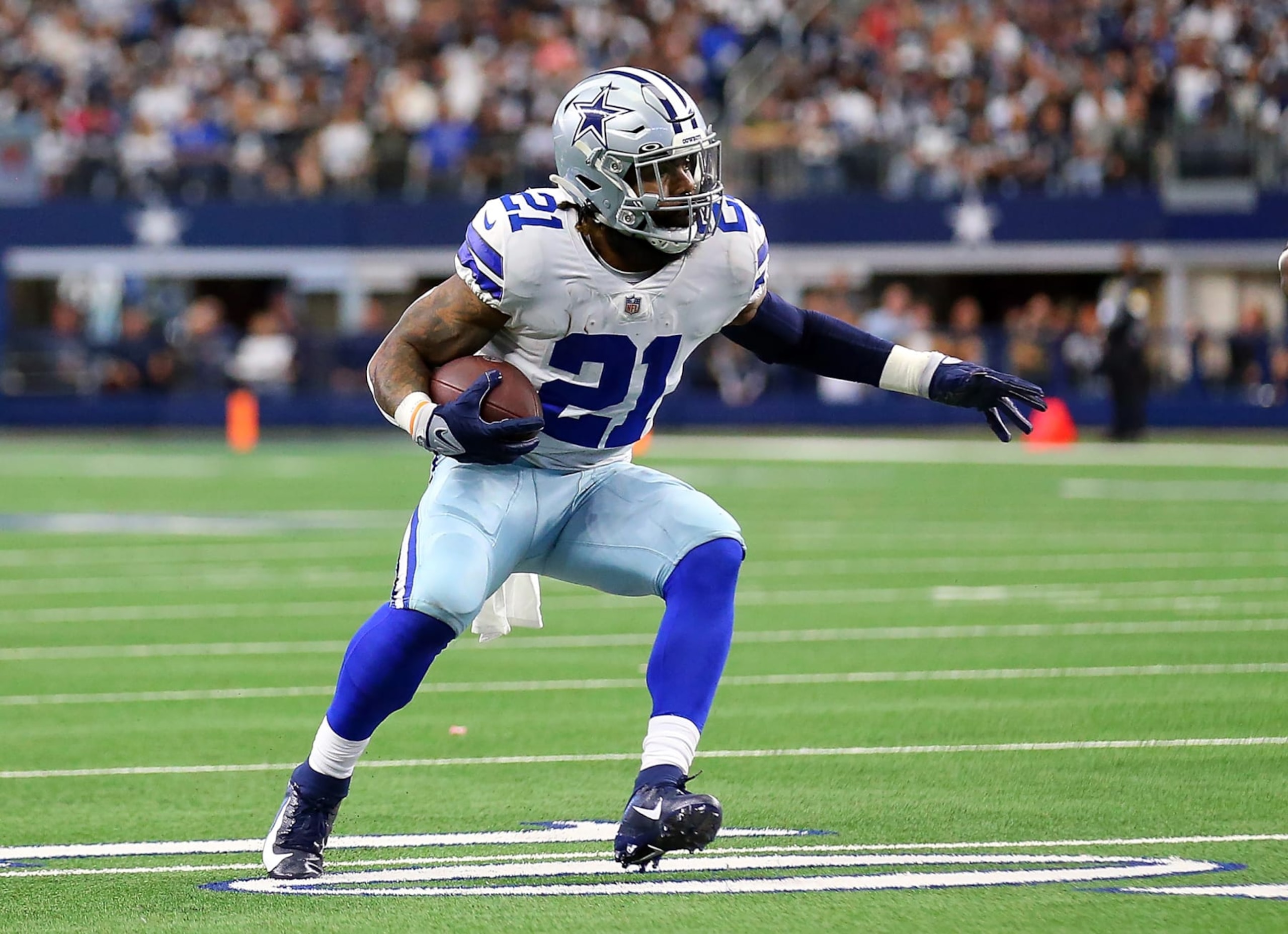 ARLINGTON, TEXAS - NOVEMBER 14: Ezekiel Elliott #21 of the Dallas Cowboys carries the ball against the Atlanta Falcons at AT&T Stadium on November 14, 2021 in Arlington, Texas. (Photo by Richard Rodriguez/Getty Images)