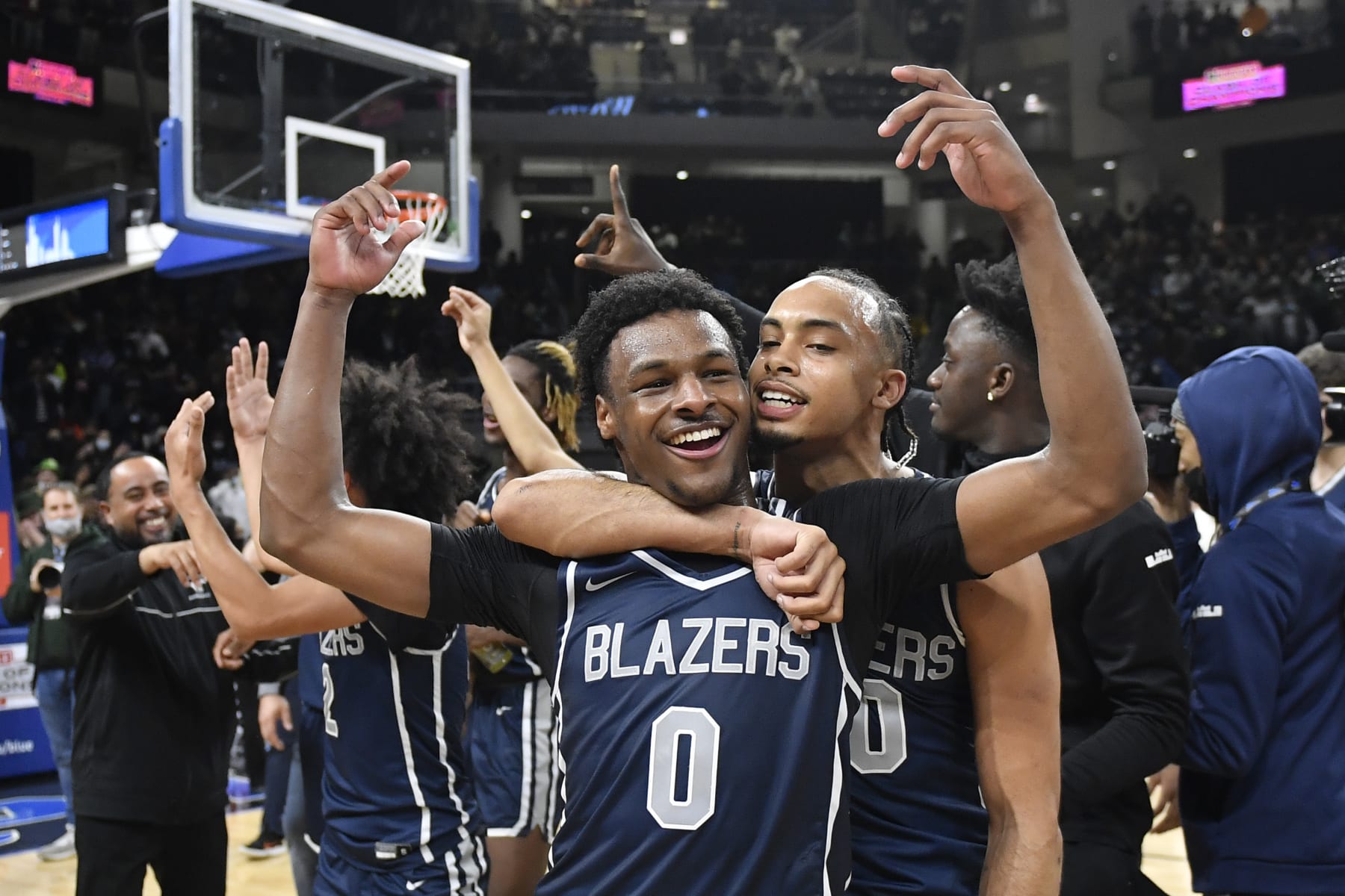 CHICAGO, ILLINOIS - FEBRUARY 05: Bronny James #0 and Amari Bailey #10 of Sierra Canyon HS celebrate after defeating Glenbard West HS at Wintrust Arena on February 05, 2022 in Chicago, Illinois. (Photo by Quinn Harris/Getty Images)