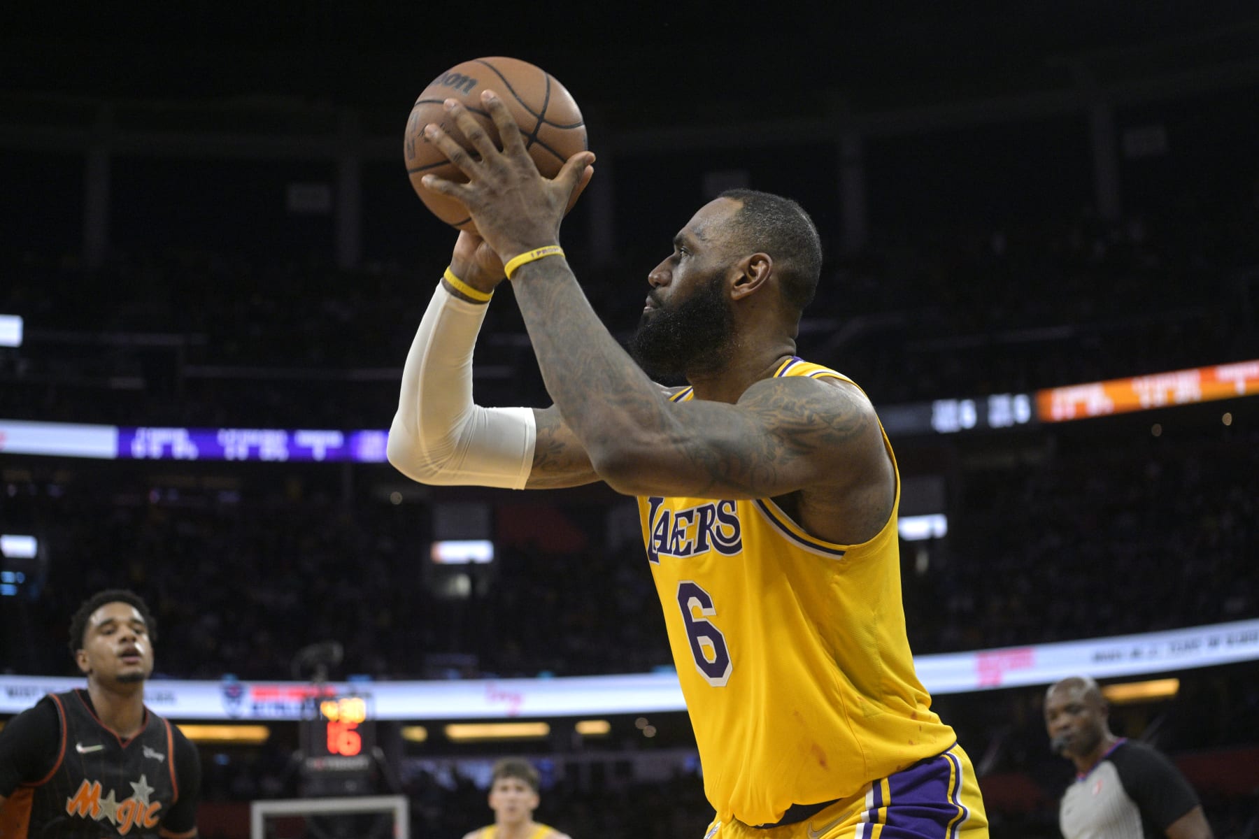 Los Angeles Lakers forward LeBron James (6) sets up for a shot during the first half of an NBA basketball game against the Orlando Magic, Friday, Jan. 21, 2022, in Orlando, Fla. (AP Photo/Phelan M. Ebenhack)
