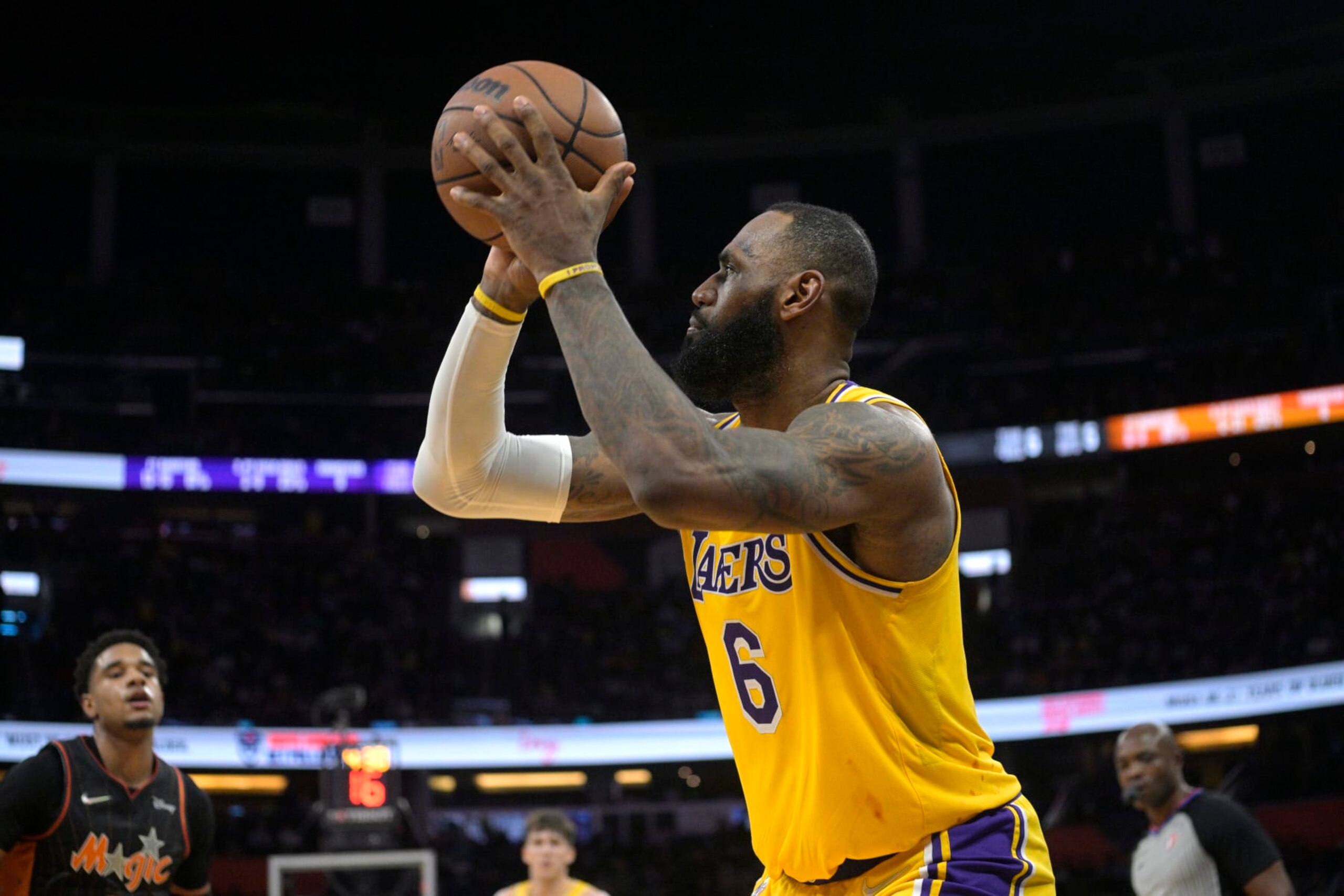Los Angeles Lakers forward LeBron James (6) sets up for a shot during the first half of an NBA basketball game against the Orlando Magic, Friday, Jan. 21, 2022, in Orlando, Fla. (AP Photo/Phelan M. Ebenhack)