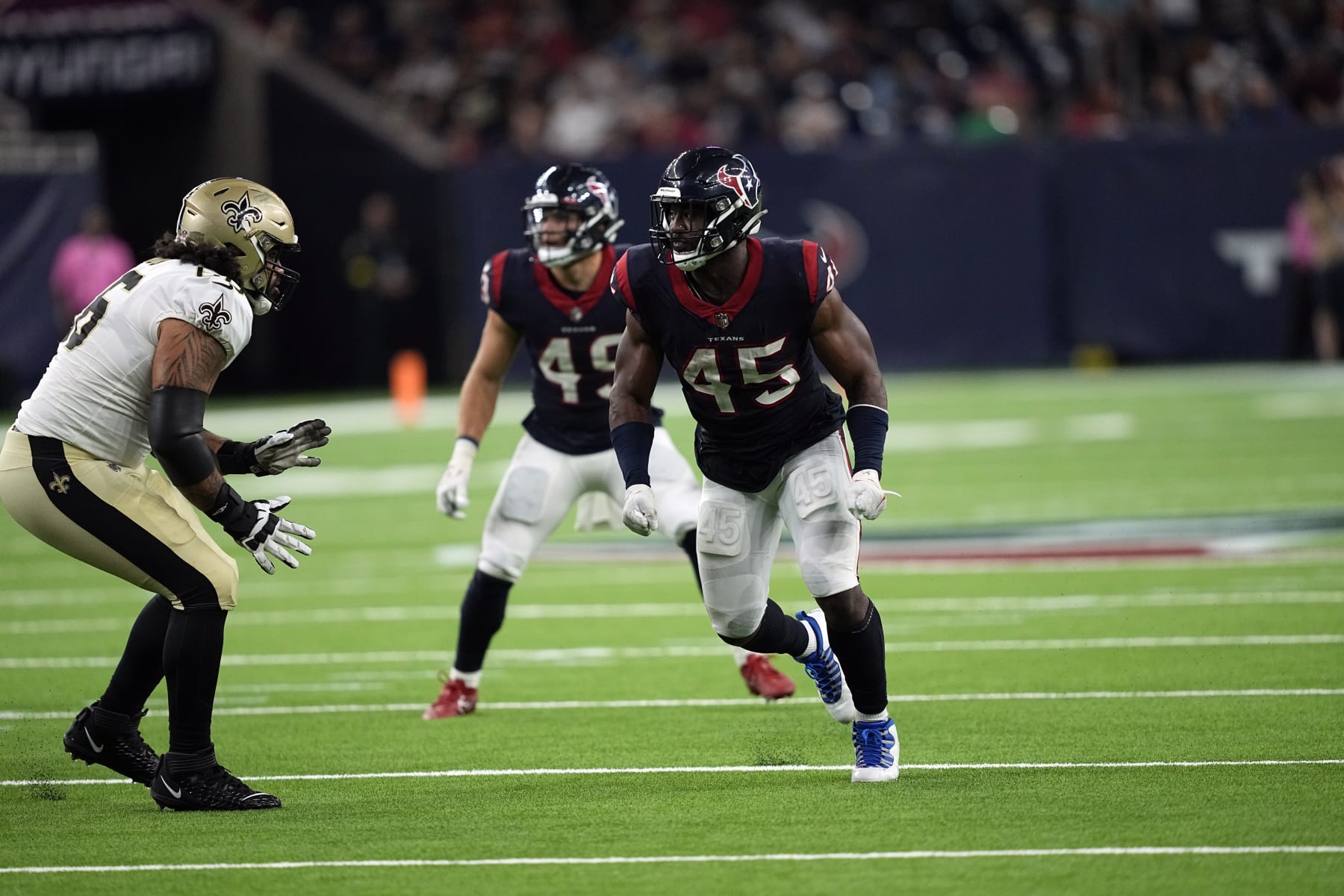 Houston Texans linebacker Ogbonnia Okoronkwo (45) rushes against the New Orleans Saints during the second half of an NFL preseason football game Saturday, Aug. 13, 2022, in Houston. (AP Photo/David J. Phillip)
