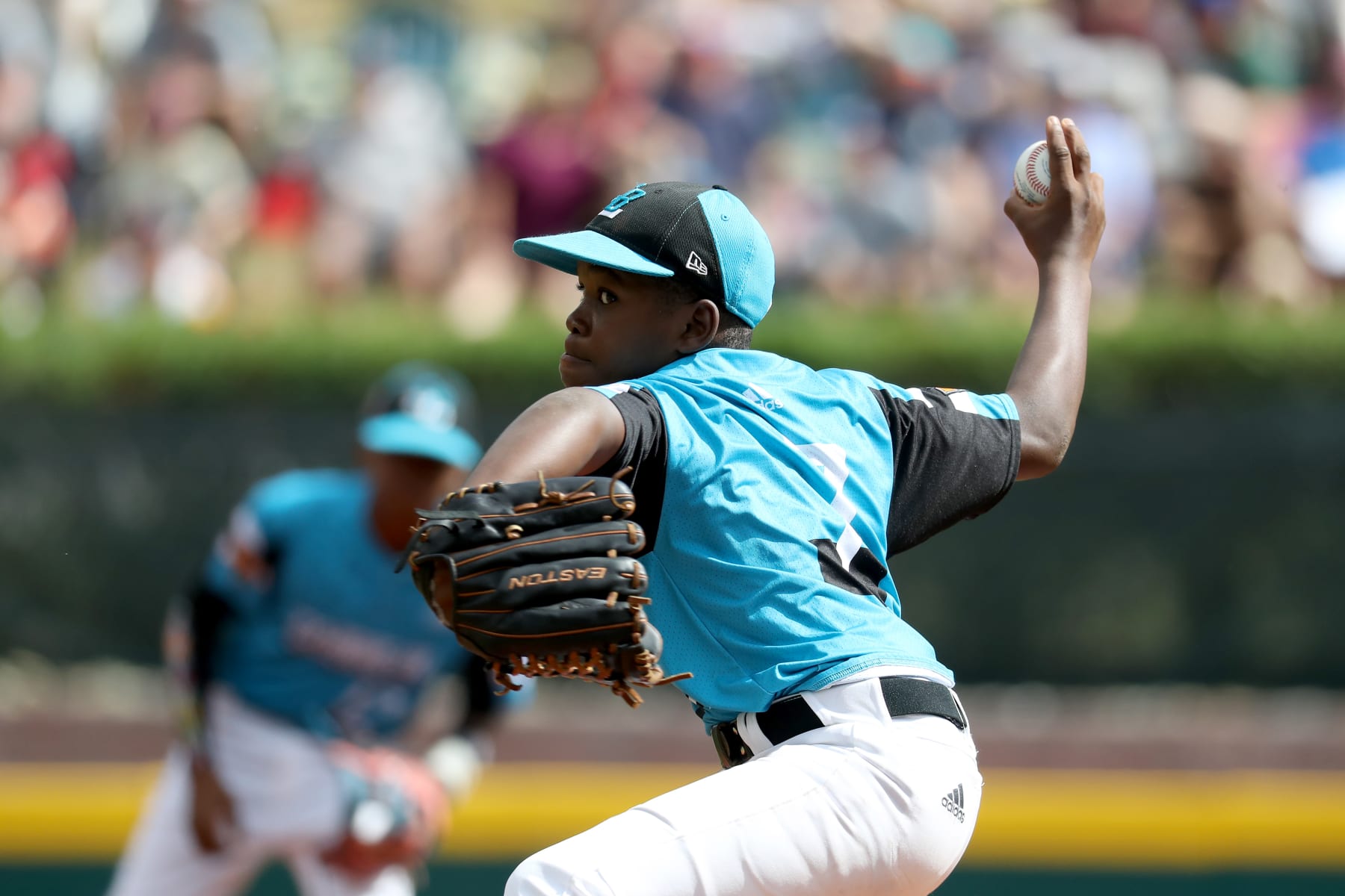 SOUTH WILLIAMSPORT, PENNSYLVANIA - AUGUST 25: Starting pitcher Keven Rosina #7 of the Caribbean Region team from Willemstad, Curacao  throws to a Southwest Region team from River Ridge Louisiana batter in the first inning against the during the Championship Game of the Little League World Series at Lamade Stadium on August 25, 2019 in South Williamsport, Pennsylvania. (Photo by Rob Carr/Getty Images)