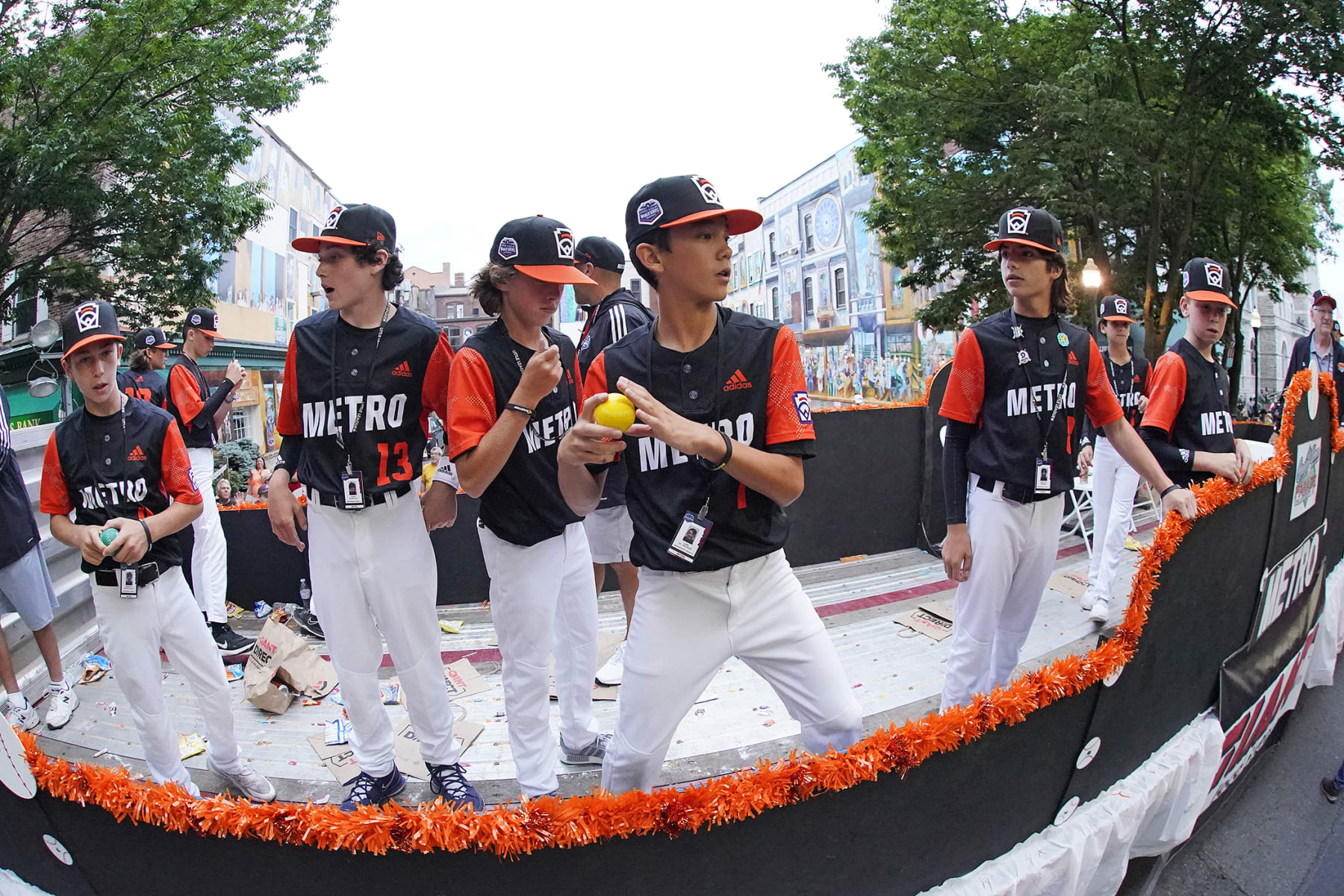 Metro Region Champion Little League team from Massapequa, N.Y. rides in the Little League Grand Slam Parade in downtown Williamsport, Pa., on Monday, Aug. 15, 2022. The Little League World Series baseball tournament, featuring 20 teams from around the world, starts on August 17, 2022 in South Williamsport, Pa. (AP Photo/Gene J. Puskar)