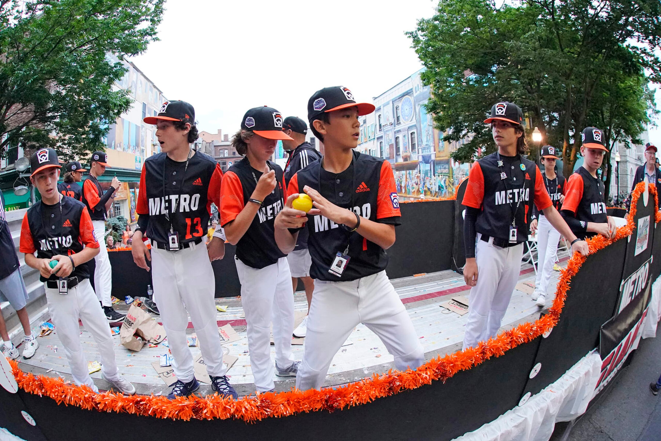 Metro Region Champion Little League team from Massapequa, N.Y. rides in the Little League Grand Slam Parade in downtown Williamsport, Pa., on Monday, Aug. 15, 2022. The Little League World Series baseball tournament, featuring 20 teams from around the world, starts on August 17, 2022 in South Williamsport, Pa. (AP Photo/Gene J. Puskar) Metro Region Champion Little League team from Massapequa, N.Y. rides in the Little League Grand Slam Parade in downtown Williamsport, Pa., on Monday, Aug. 15, 2022. The Little League World Series baseball tournament, featuring 20 teams from around the world, starts on August 17, 2022 in South Williamsport, Pa. (AP Photo/Gene J. Puskar)