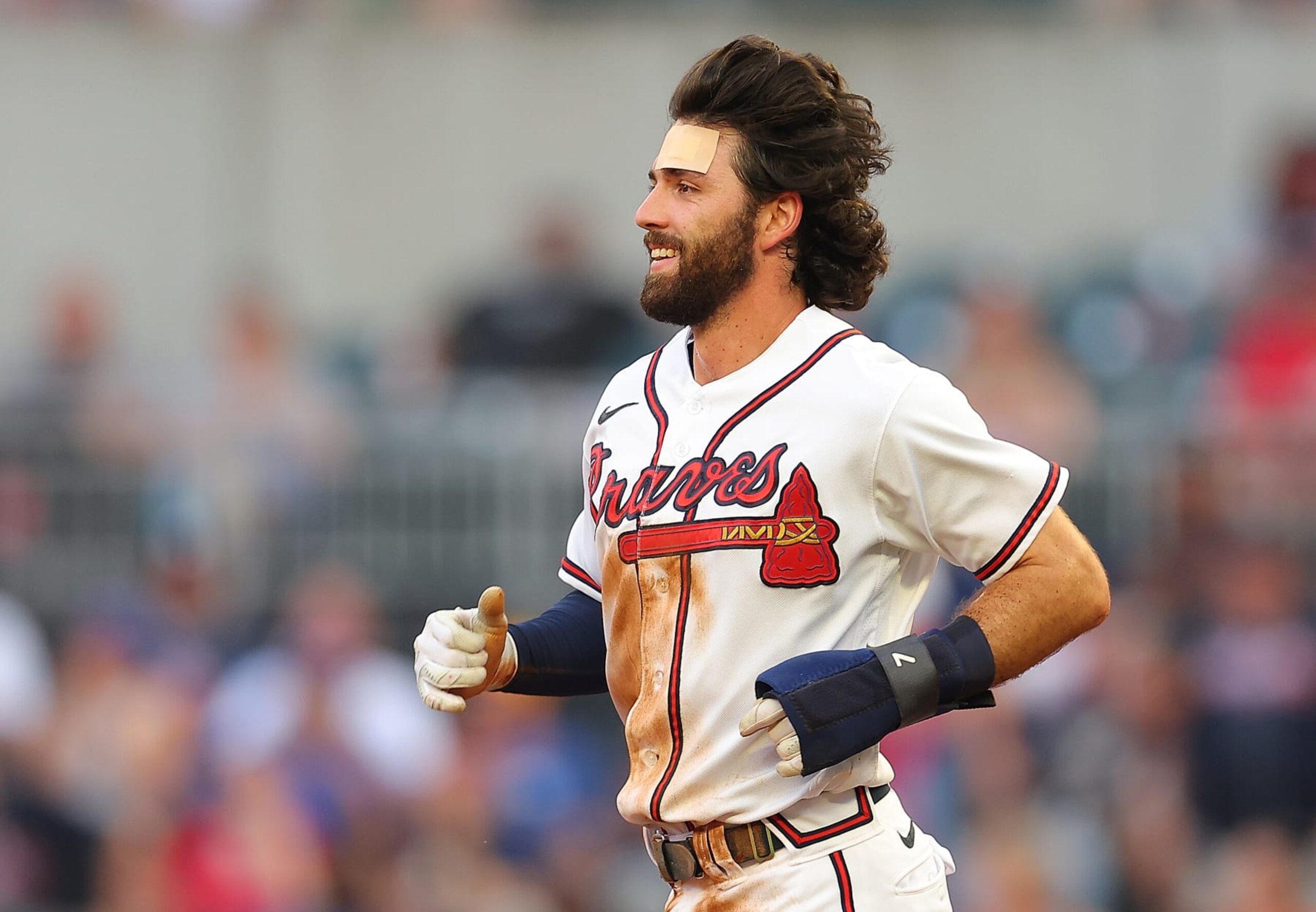 ATLANTA, GA - AUGUST 15: Dansby Swanson #7 of the Atlanta Braves reacts after being treated for being hit in the face by his helmet after sliding safely into second base on a double in the first inning against the New York Mets at Truist Park on August 15, 2022 in Atlanta, Georgia. (Photo by Kevin C. Cox/Getty Images) ATLANTA, GA - AUGUST 15: Dansby Swanson #7 of the Atlanta Braves reacts after being treated for being hit in the face by his helmet after sliding safely into second base on a double in the first inning against the New York Mets at Truist Park on August 15, 2022 in Atlanta, Georgia. (Photo by Kevin C. Cox/Getty Images)
