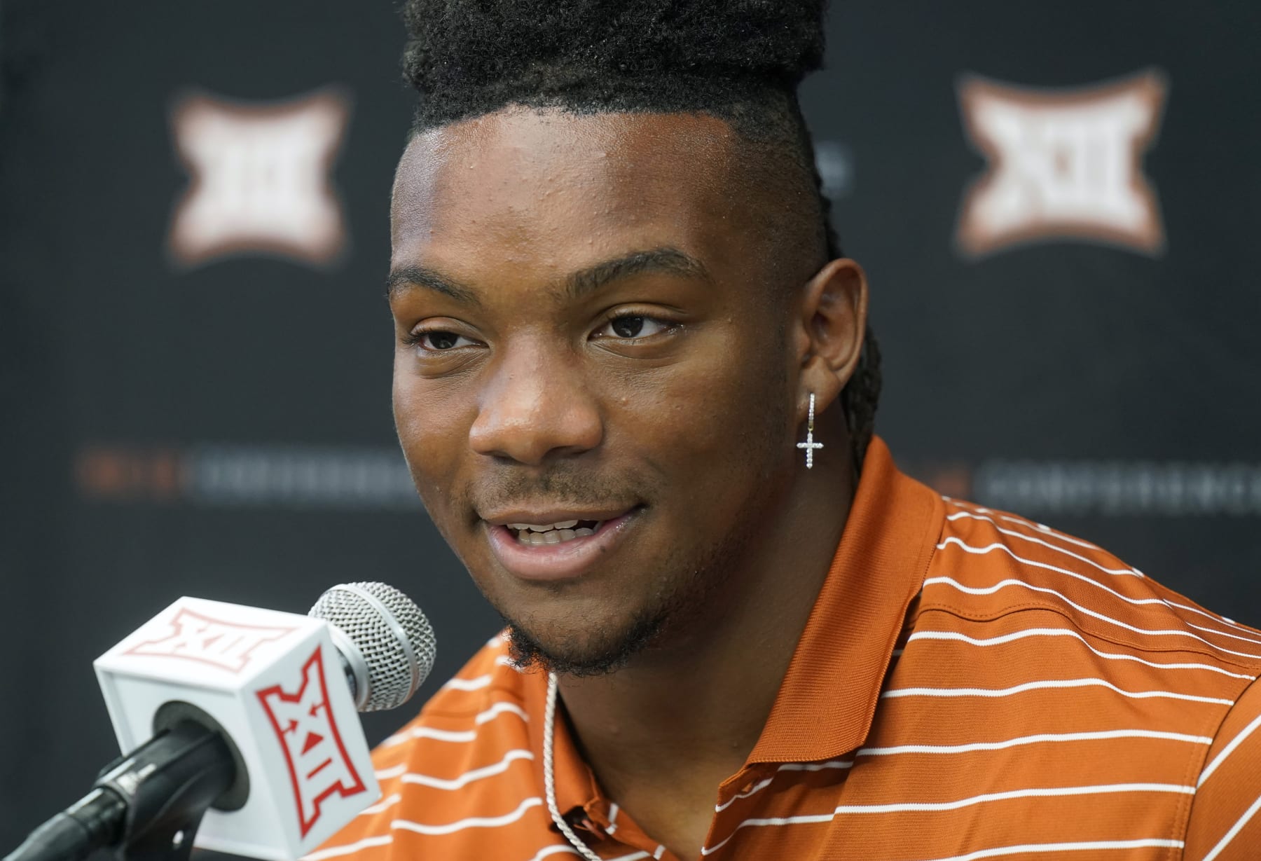 Texas running back Bijan Robinson speaks at the NCAA college football Big 12 media days in Arlington, Texas, Thursday, July 14, 2022. (AP Photo/LM Otero)