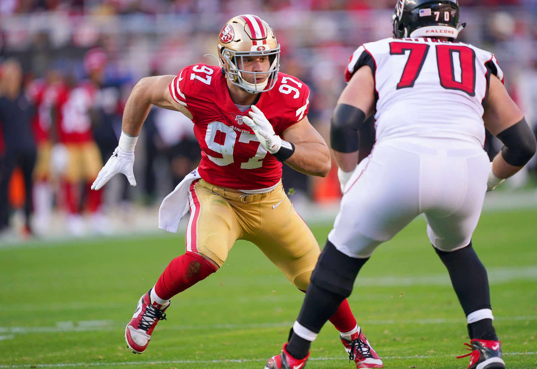 SANTA CLARA, CALIFORNIA - DECEMBER 15: Nick Bosa #97 of the San Francisco 49ers looks to rush past Jake Matthews #70 of the Atlanta Falcons during the second half of an NFL football game at Levi's Stadium on December 15, 2019 in Santa Clara, California. (Photo by Thearon W. Henderson/Getty Images)