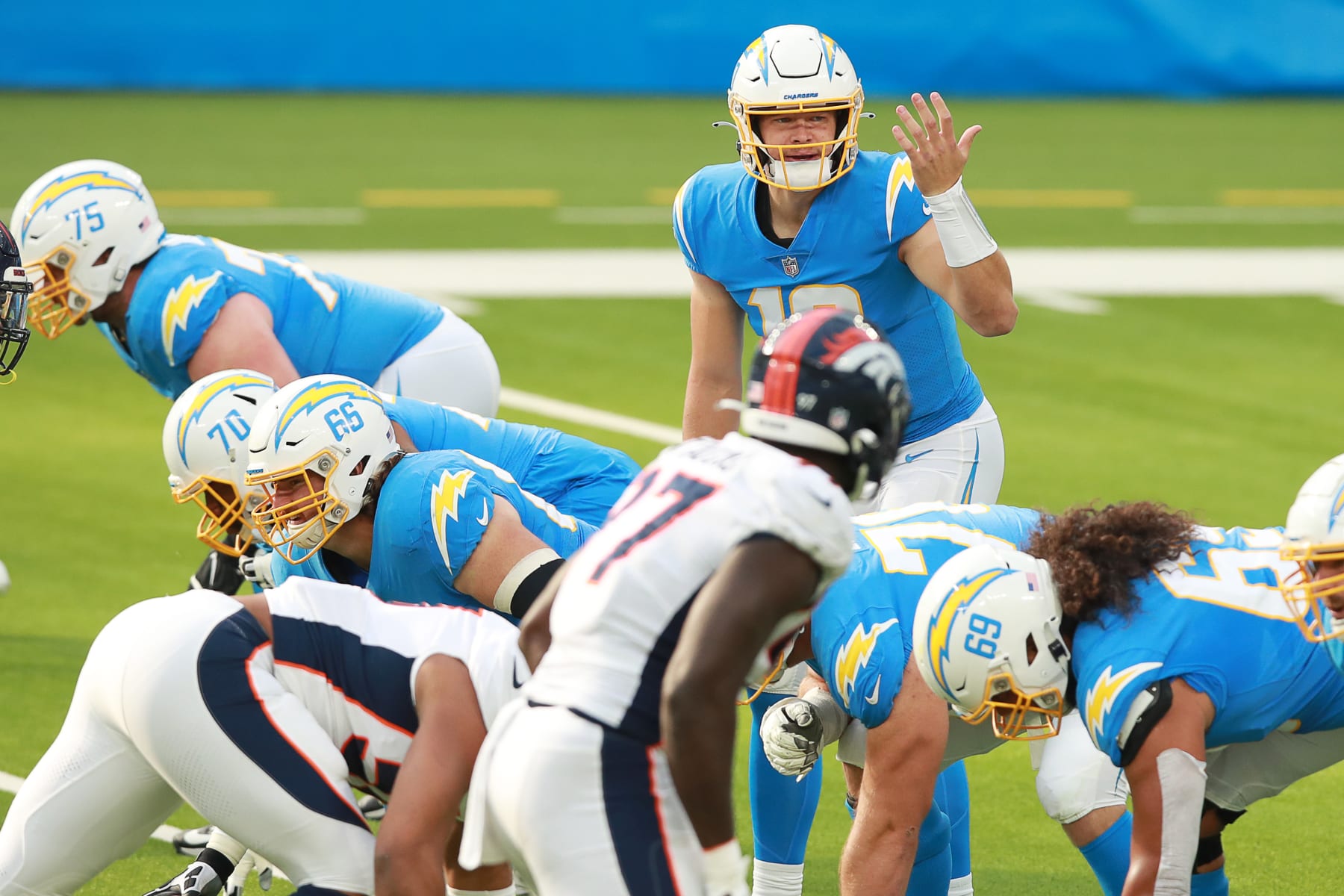 INGLEWOOD, CALIFORNIA - DECEMBER 27: Justin Herbert #10 of the Los Angeles Chargers makes a play call from the back field in the first quarter against the Denver Broncos at SoFi Stadium on December 27, 2020 in Inglewood, California. (Photo by Joe Scarnici/Getty Images)