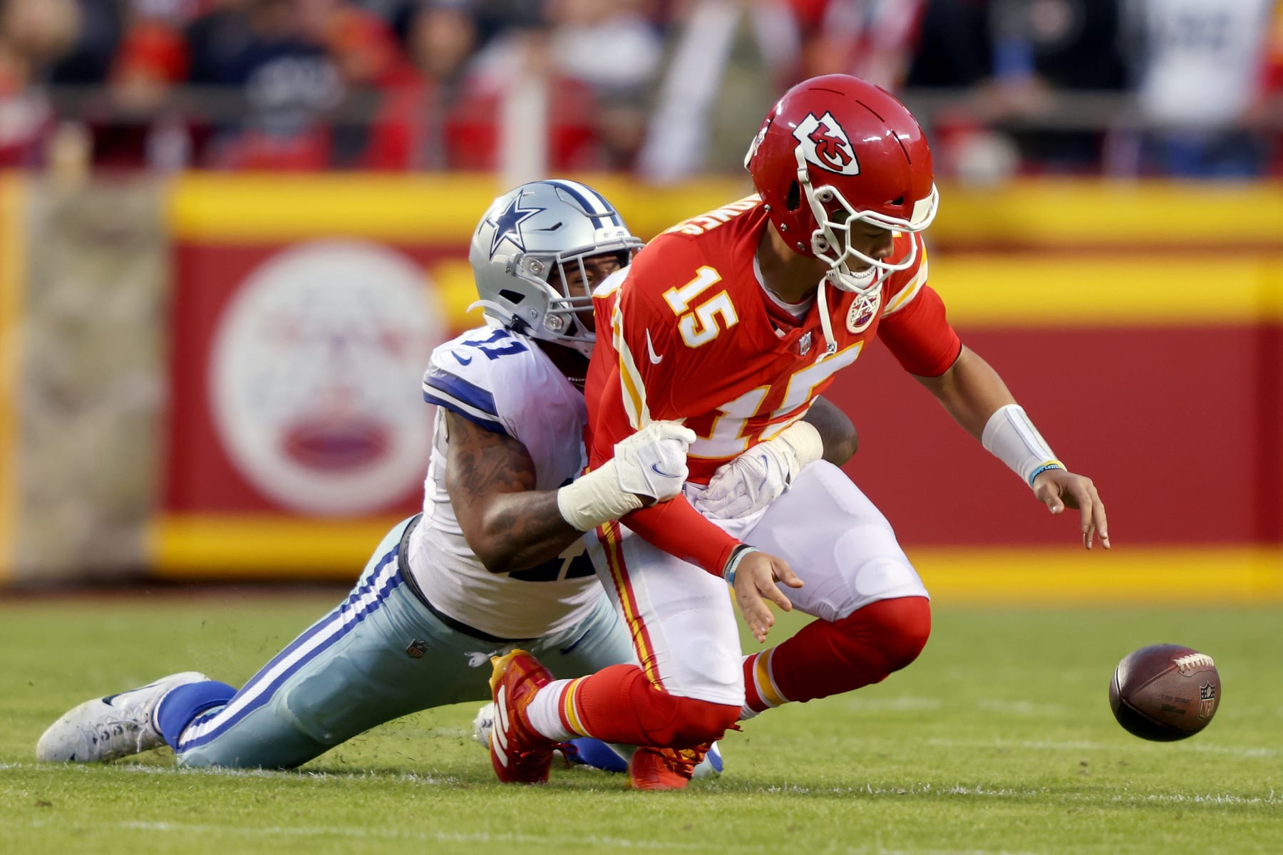 KANSAS CITY, MISSOURI - NOVEMBER 21:  Micah Parsons #11 of the Dallas Cowboys strips the ball from Patrick Mahomes #15 of the Kansas City Chiefs in the second quarter of the game at Arrowhead Stadium on November 21, 2021 in Kansas City, Missouri. The Cowboys recovered the fumbled ball. (Photo by Jamie Squire/Getty Images)