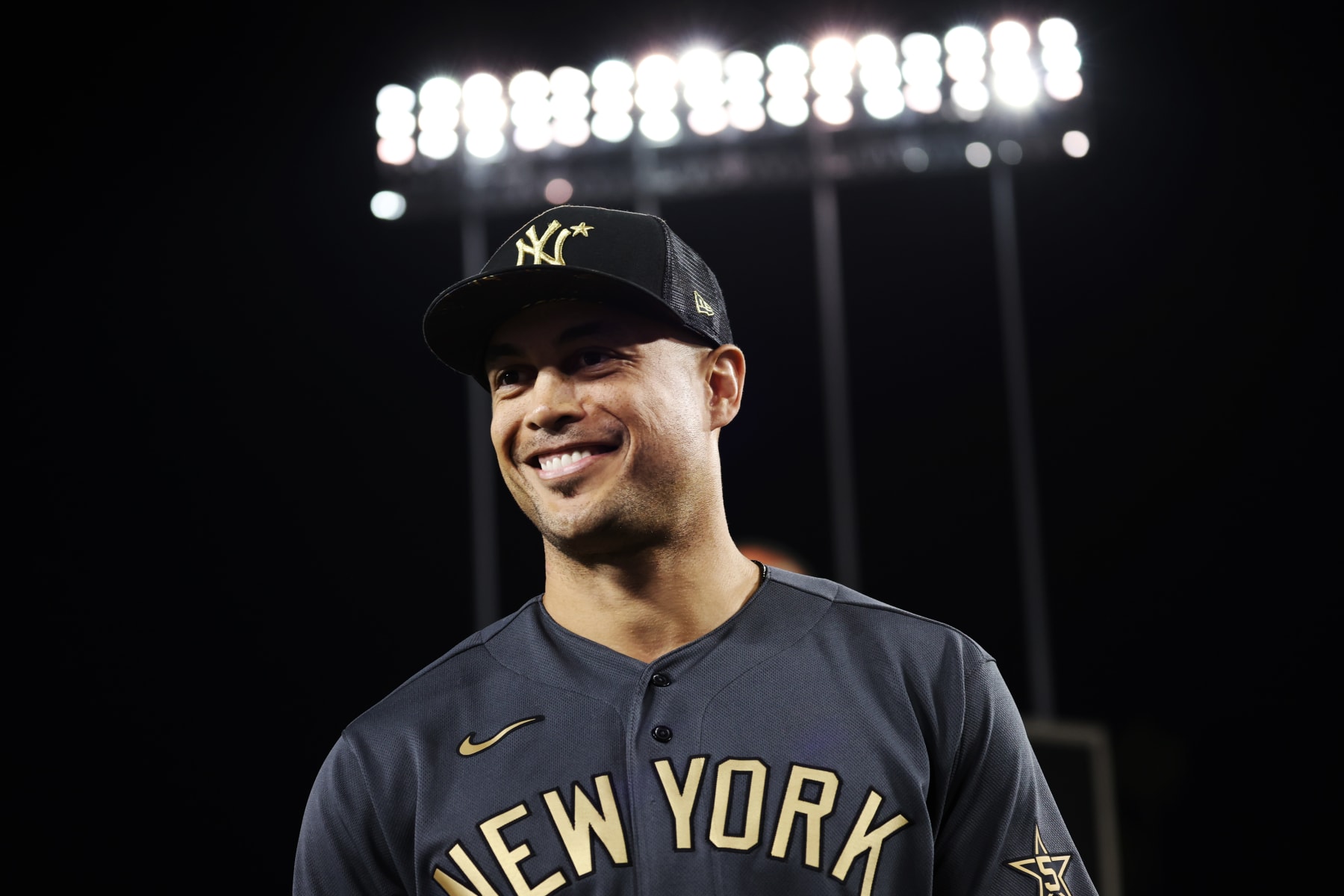LOS ANGELES, CA - JULY 19:  Giancarlo Stanton #27 of the New York Yankees smiles as he is presented with the Ted Williams MVP trophy after the 92nd MLB All-Star Game presented by Mastercard at Dodger Stadium on Tuesday, July 19, 2022 in Los Angeles, California. (Photo by Mary DeCicco/MLB Photos via Getty Images)