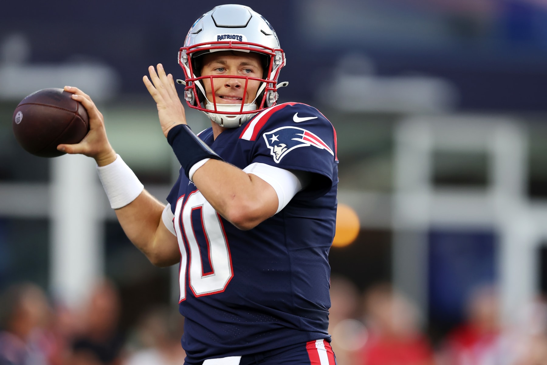 FOXBOROUGH, MASSACHUSETTS - AUGUST 19: Mac Jones #10 of the New England Patriots warms up during the preseason game between the New England Patriots and the Carolina Panthers at Gillette Stadium on August 19, 2022 in Foxborough, Massachusetts. (Photo by Maddie Meyer/Getty Images)