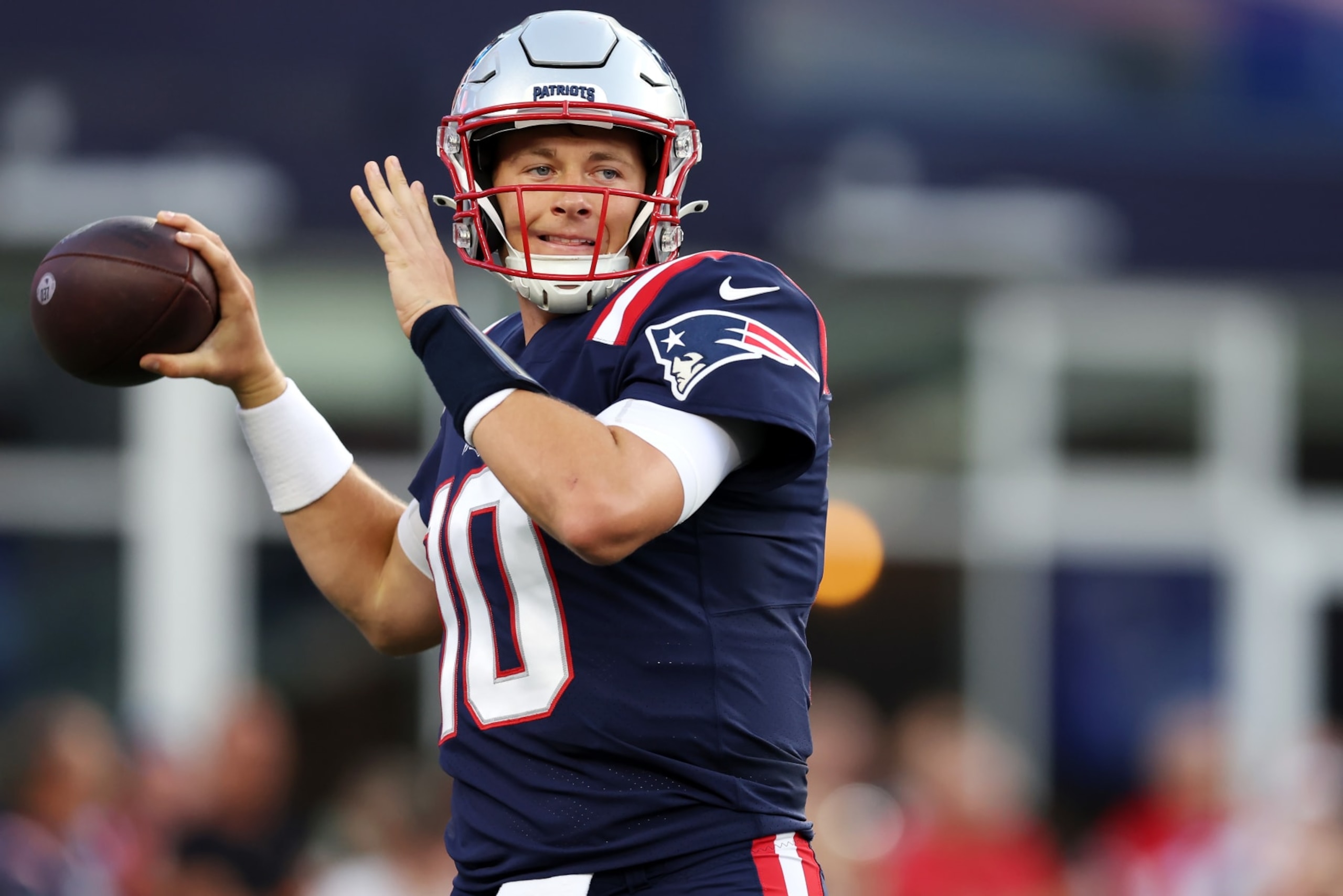 FOXBOROUGH, MASSACHUSETTS - AUGUST 19: Mac Jones #10 of the New England Patriots warms up during the preseason game between the New England Patriots and the Carolina Panthers at Gillette Stadium on August 19, 2022 in Foxborough, Massachusetts. (Photo by Maddie Meyer/Getty Images)