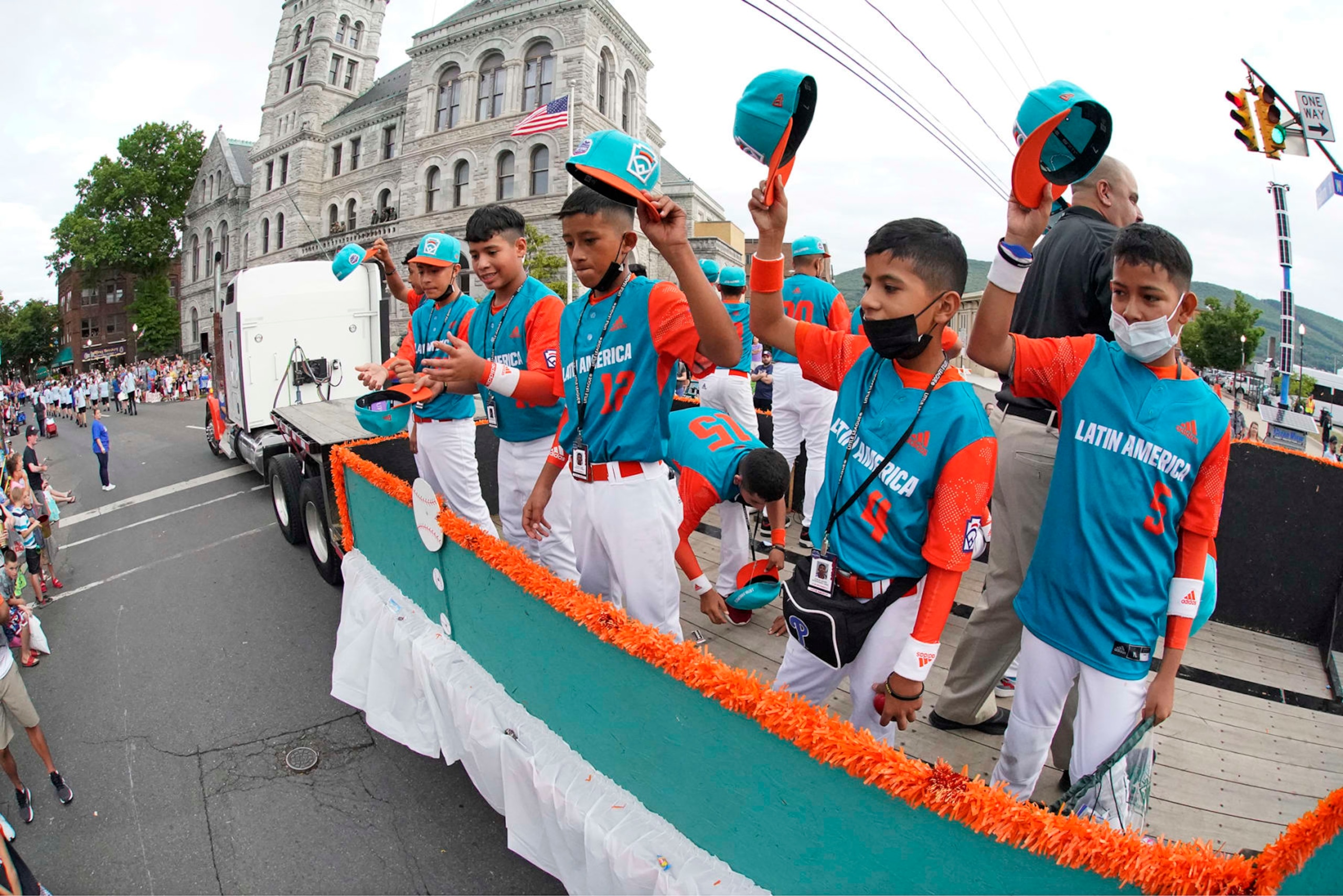 Latin America Region Champion Little League team from Managua, Nicaragua, rides in the Little League Grand Slam Parade in downtown Williamsport, Pa., on Monday, Aug. 15, 2022. The Little League World Series baseball tournament, featuring 20 teams from around the world, starts on August 17, 2022 in South Williamsport, Pa. (AP Photo/Gene J. Puskar)