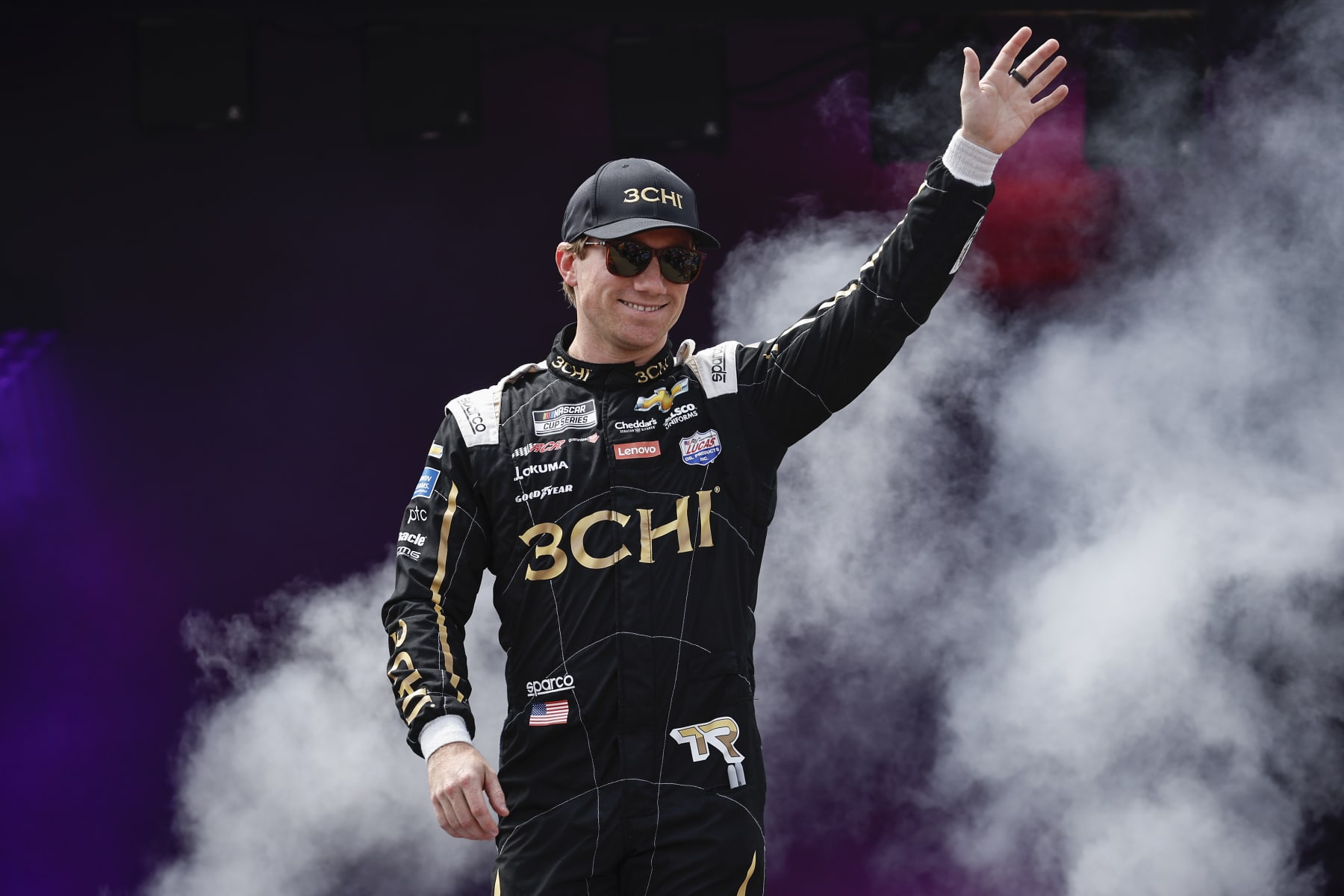 RICHMOND, VIRGINIA - AUGUST 14: Tyler Reddick, driver of the #8 3CHI Chevrolet, waves to fans as he walks onstage during driver intros prior to the NASCAR Cup Series Federated Auto Parts 400 at Richmond Raceway on August 14, 2022 in Richmond, Virginia. (Photo by Chris Graythen/Getty Images)