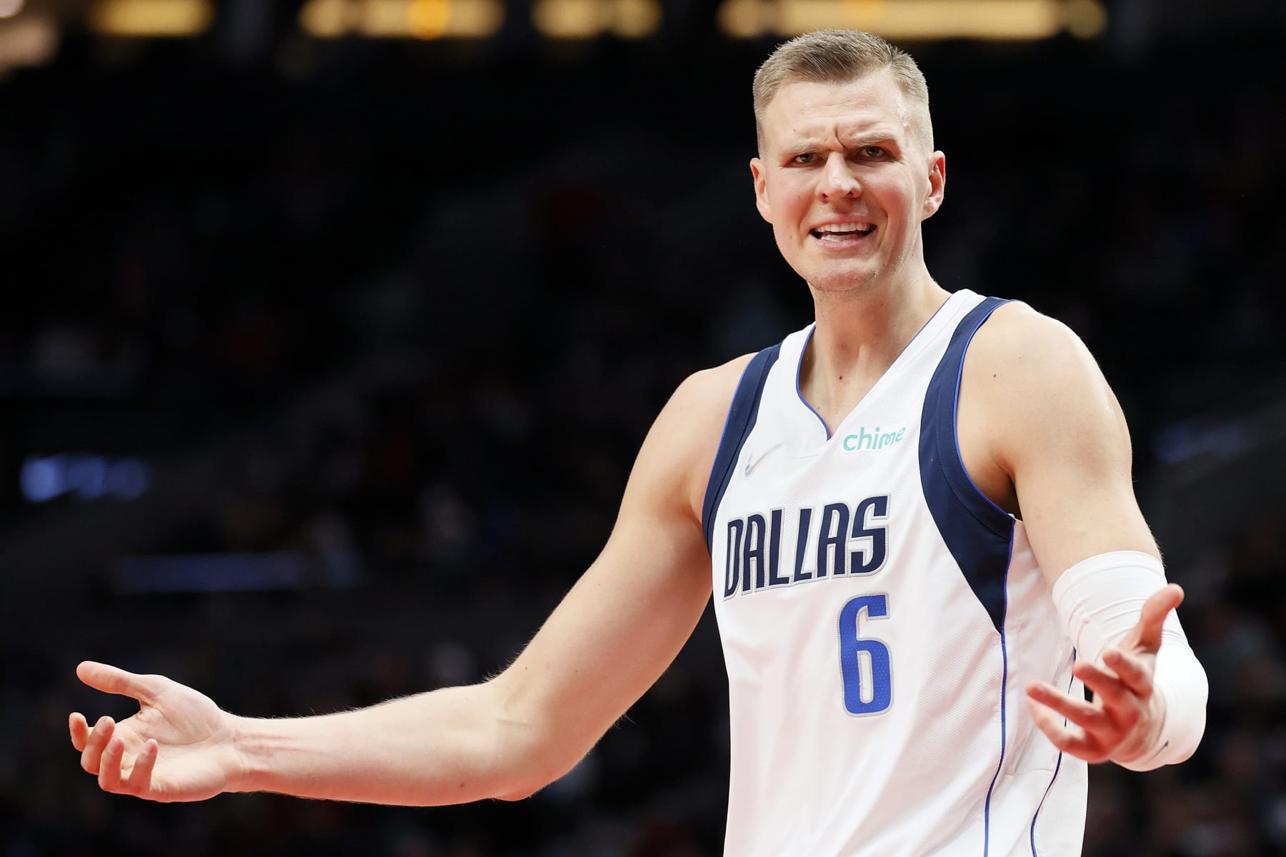 PORTLAND, OREGON - JANUARY 26: Kristaps Porzingis #6 of the Dallas Mavericks reacts during the third quarter against the Portland Trail Blazers at Moda Center on January 26, 2022 in Portland, Oregon. NOTE TO USER: User expressly acknowledges and agrees that, by downloading and/or using this photograph, User is consenting to the terms and conditions of the Getty Images License Agreement. (Photo by Steph Chambers/Getty Images)