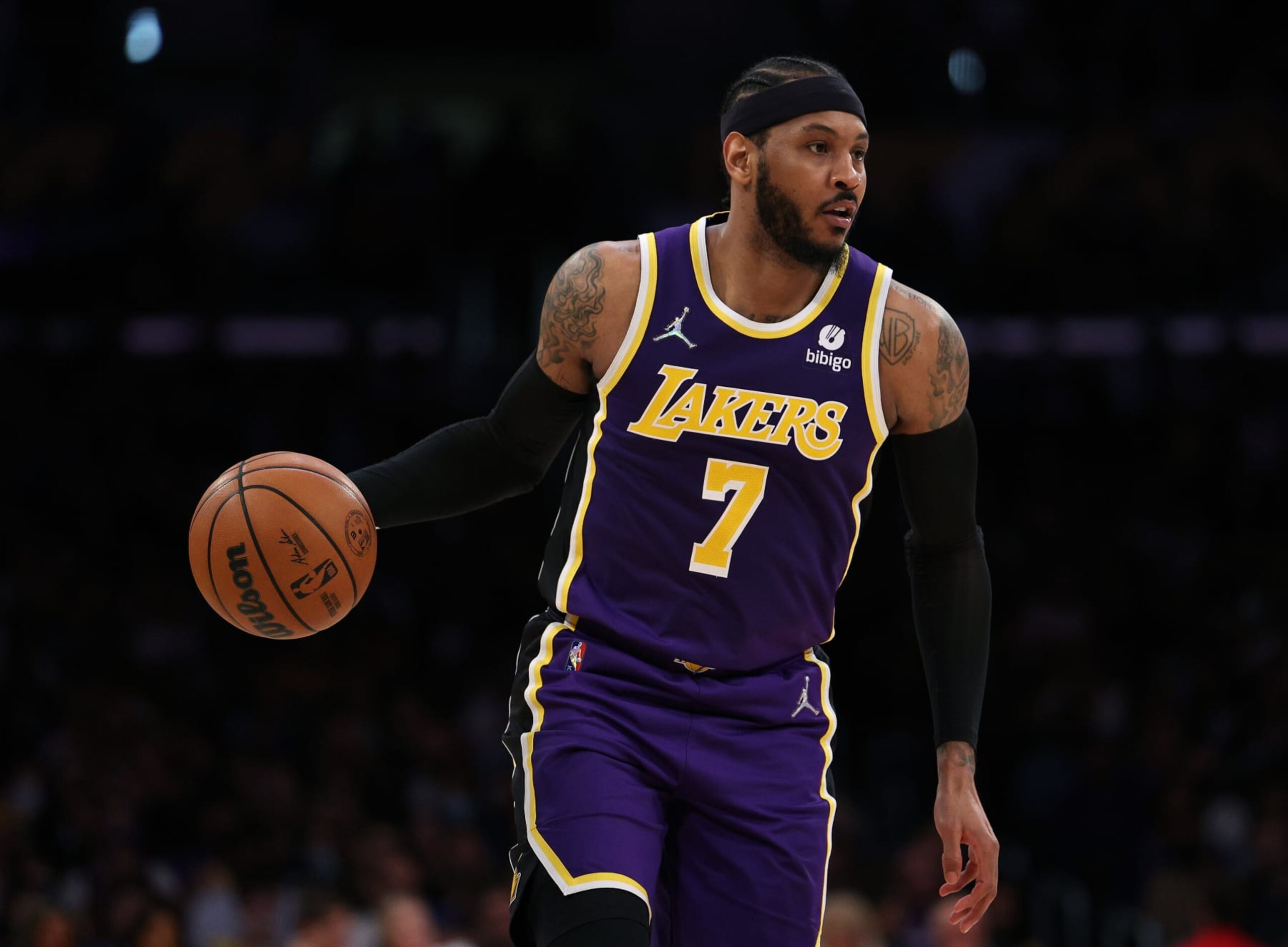 LOS ANGELES, CALIFORNIA - MARCH 23: Carmelo Anthony #7 of the Los Angeles Lakers dribbles during a 126-121 Philadelphia 76ers win at Crypto.com Arena on March 23, 2022 in Los Angeles, California. (Photo by Harry How/Getty Images) NOTE TO USER: User expressly acknowledges and agrees that, by downloading and/or using this Photograph, user is consenting to the terms and conditions of the Getty Images License Agreement. Mandatory Copyright Notice: Copyright 2022 NBAE