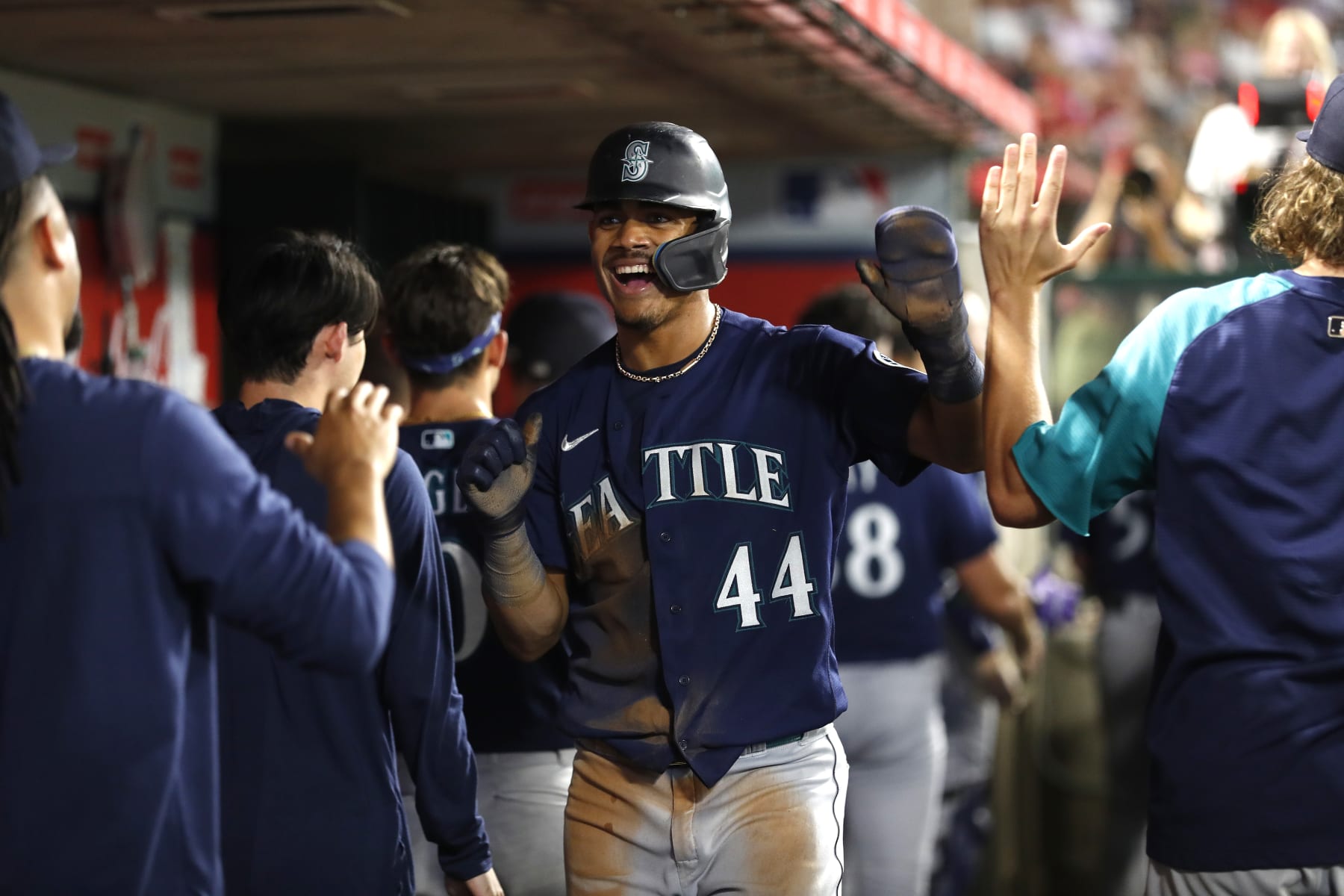 ANAHEIM, CALIFORNIA - AUGUST 16: Julio Rodriguez #44 of the Seattle Mariners celebrates with teammates after scoring against the Los Angeles Angels during the sixth inning at Angel Stadium of Anaheim on August 16, 2022 in Anaheim, California. (Photo by Michael Owens/Getty Images)