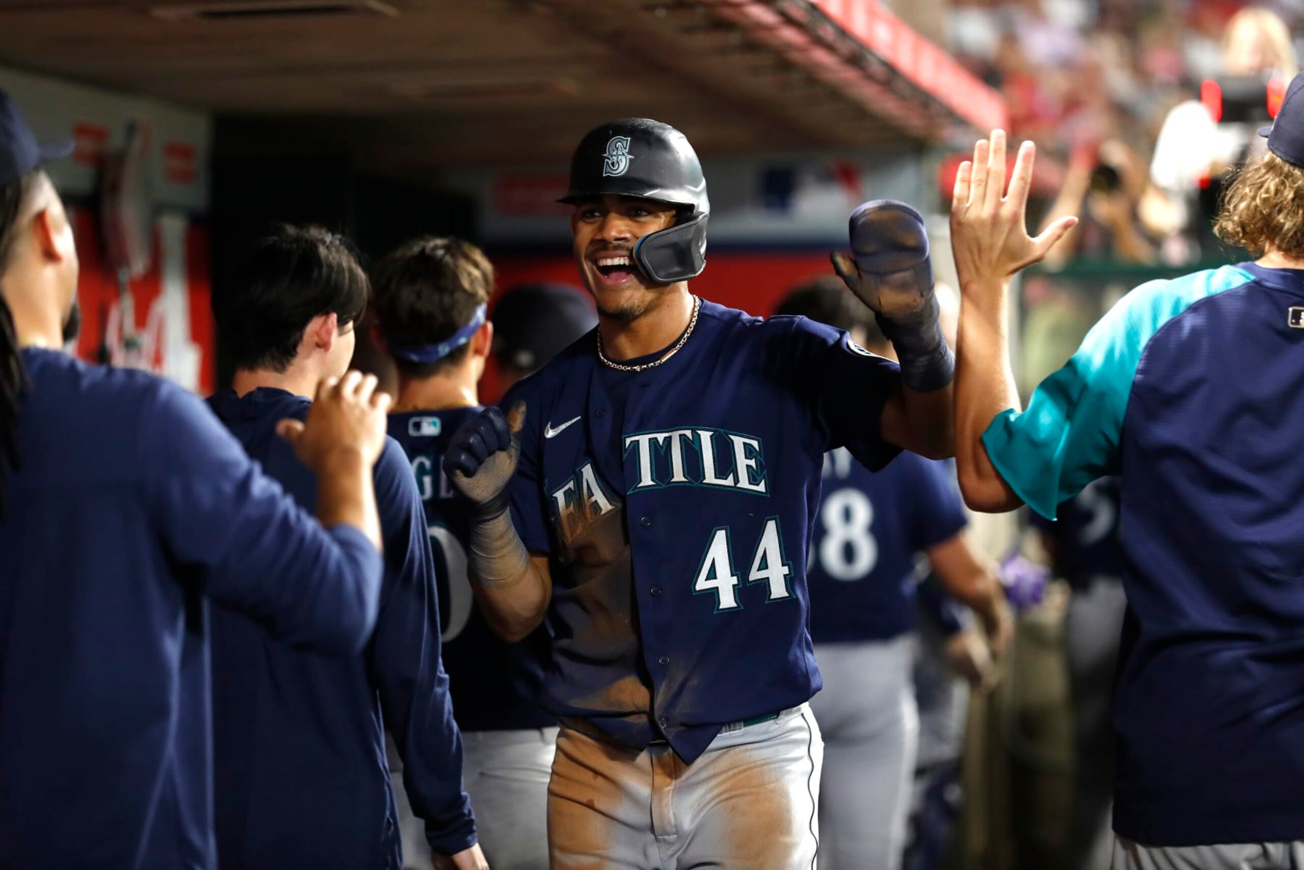 ANAHEIM, CALIFORNIA - AUGUST 16: Julio Rodriguez #44 of the Seattle Mariners celebrates with teammates after scoring against the Los Angeles Angels during the sixth inning at Angel Stadium of Anaheim on August 16, 2022 in Anaheim, California. (Photo by Michael Owens/Getty Images)