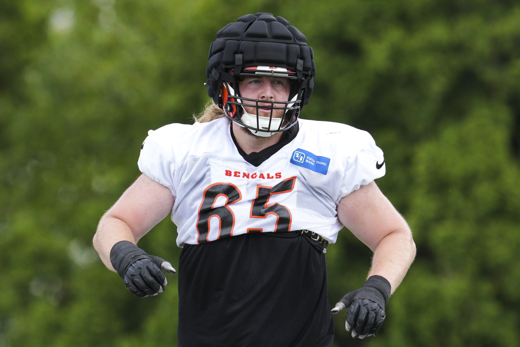 Cincinnati Bengals guard Alex Cappa (65) performs a drill during NFL football training camp Wednesday, Aug. 10, 2022, in Cincinnati. (AP Photo/Jeff Dean)