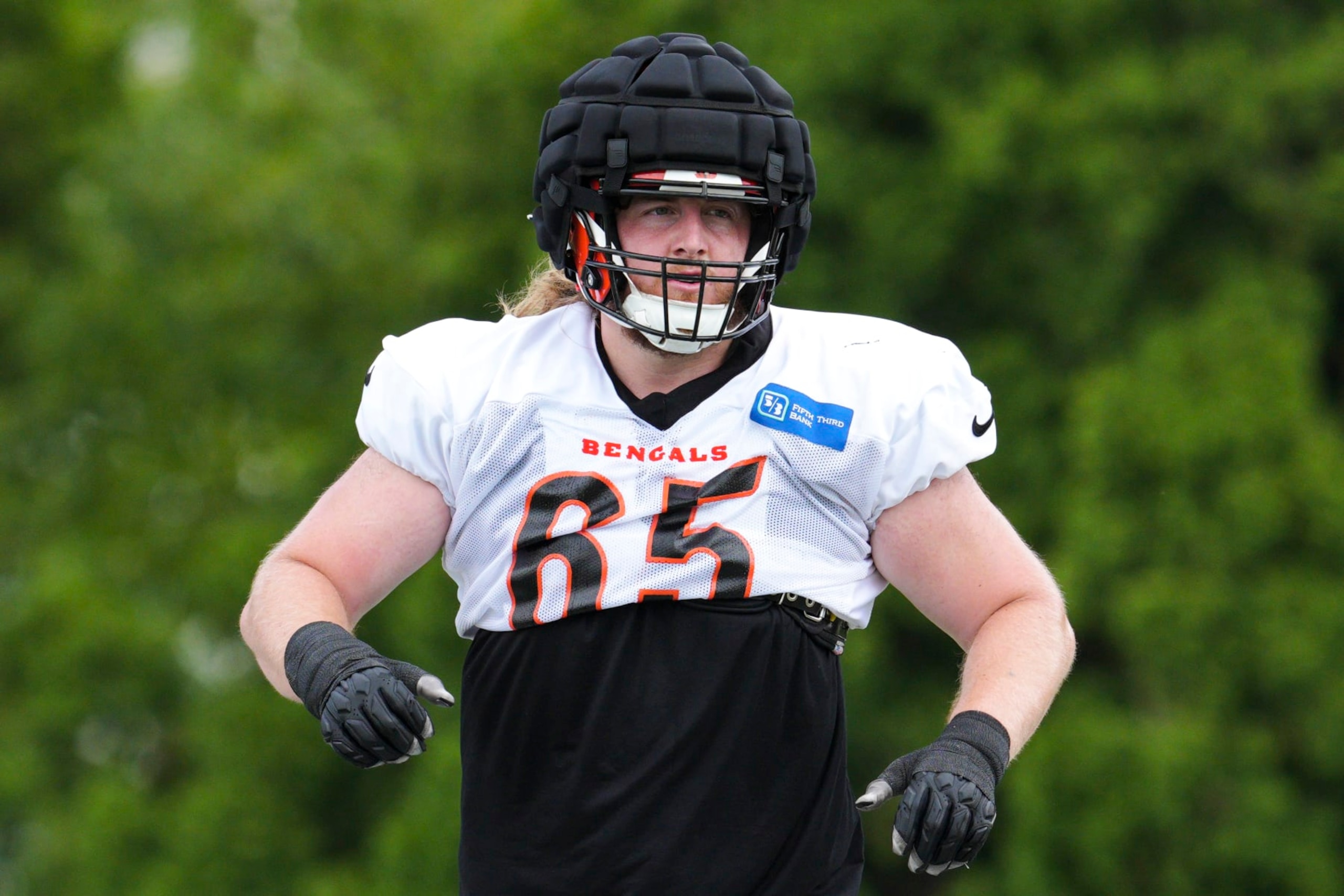 Cincinnati Bengals guard Alex Cappa (65) performs a drill during NFL football training camp Wednesday, Aug. 10, 2022, in Cincinnati. (AP Photo/Jeff Dean) Cincinnati Bengals guard Alex Cappa (65) performs a drill during NFL football training camp Wednesday, Aug. 10, 2022, in Cincinnati. (AP Photo/Jeff Dean)