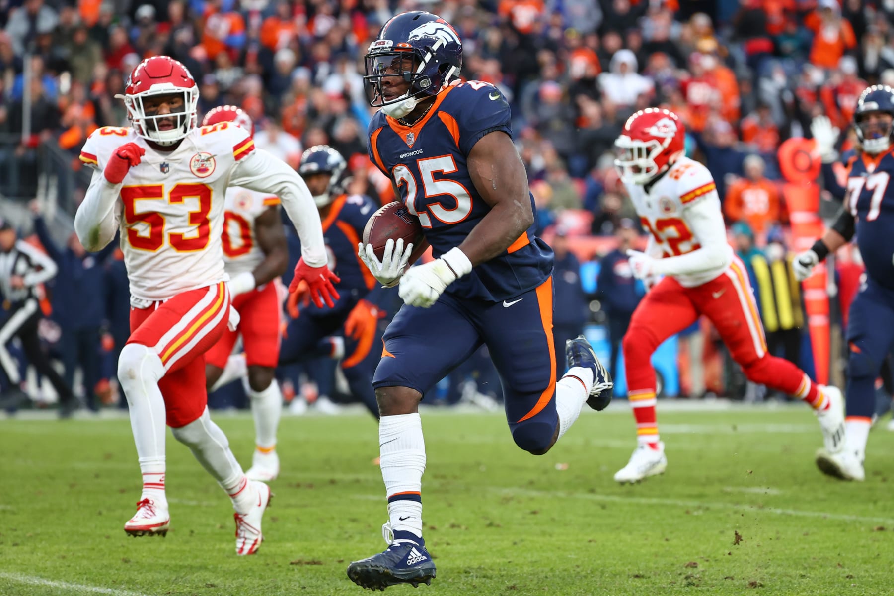 DENVER, COLORADO - JANUARY 08: Melvin Gordon #25 of the Denver Broncos rushes for a touchdown during the third quarter against the Kansas City Chiefs at Empower Field At Mile High on January 08, 2022 in Denver, Colorado. (Photo by Jamie Schwaberow/Getty Images)
