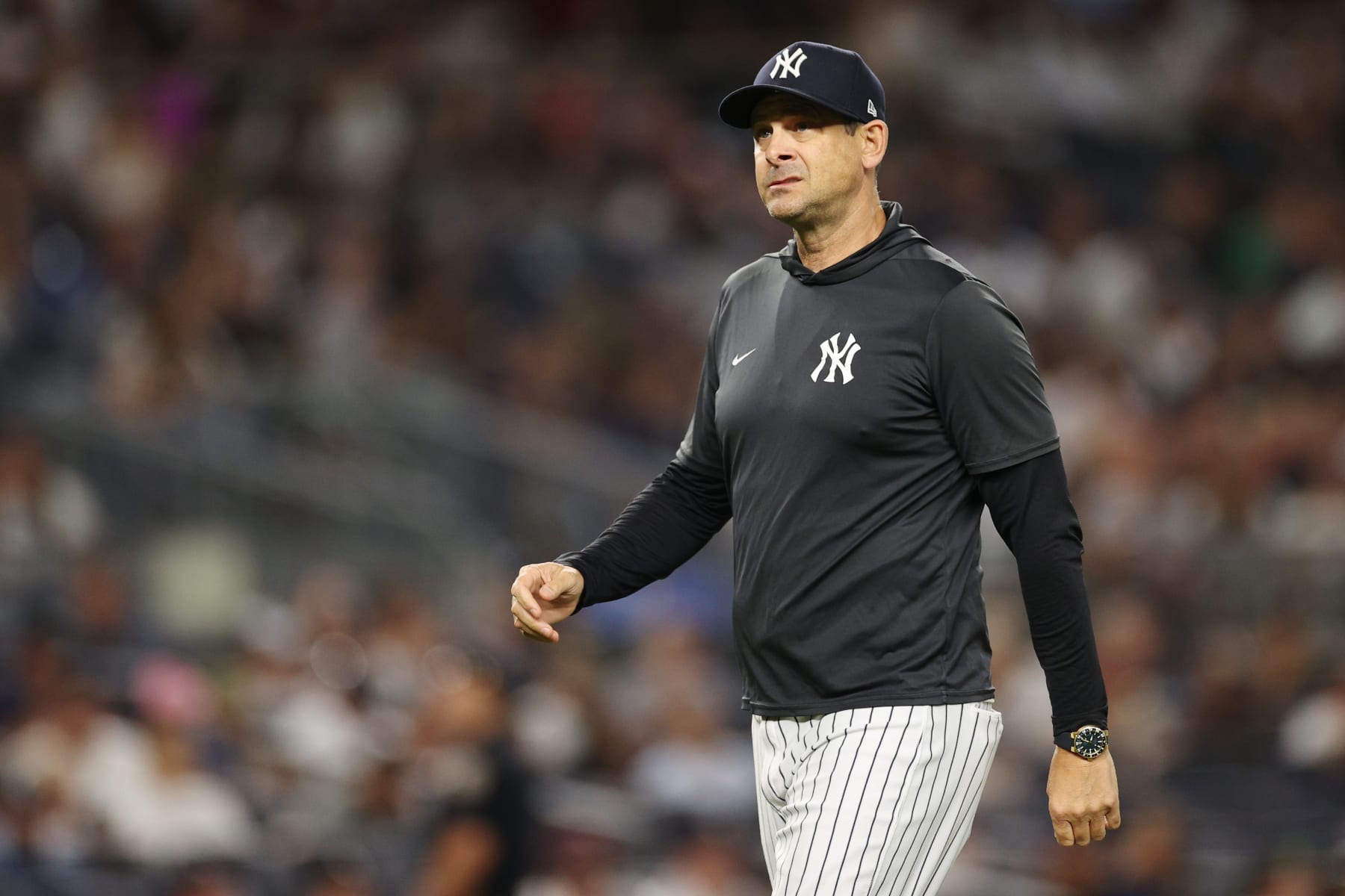 NEW YORK, NEW YORK - AUGUST 15: Manager Aaron Boone #17 of the New York Yankees looks on during the eighth inning against the Tampa Bay Rays at Yankee Stadium on August 15, 2022 in the Bronx borough of New York City. The Rays won 4-0. (Photo by Sarah Stier/Getty Images)