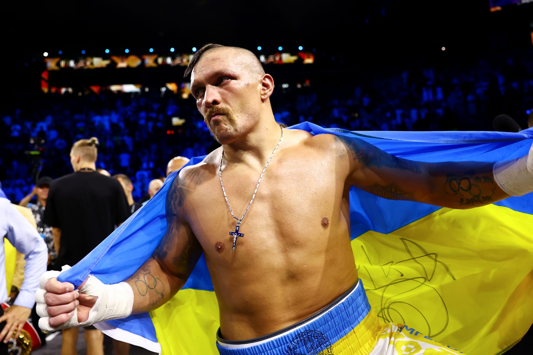 JEDDAH, SAUDI ARABIA - AUGUST 20: Oleksandr Usyk celebrates with a flag of Ukraine after their victory over Anthony Joshua in their World Heavyweight Championship fight during the Rage on the Red Sea Heavyweight Title Fight at King Abdullah Sports City Arena on August 20, 2022 in Jeddah, Saudi Arabia. (Photo by Francois Nel/Getty Images)