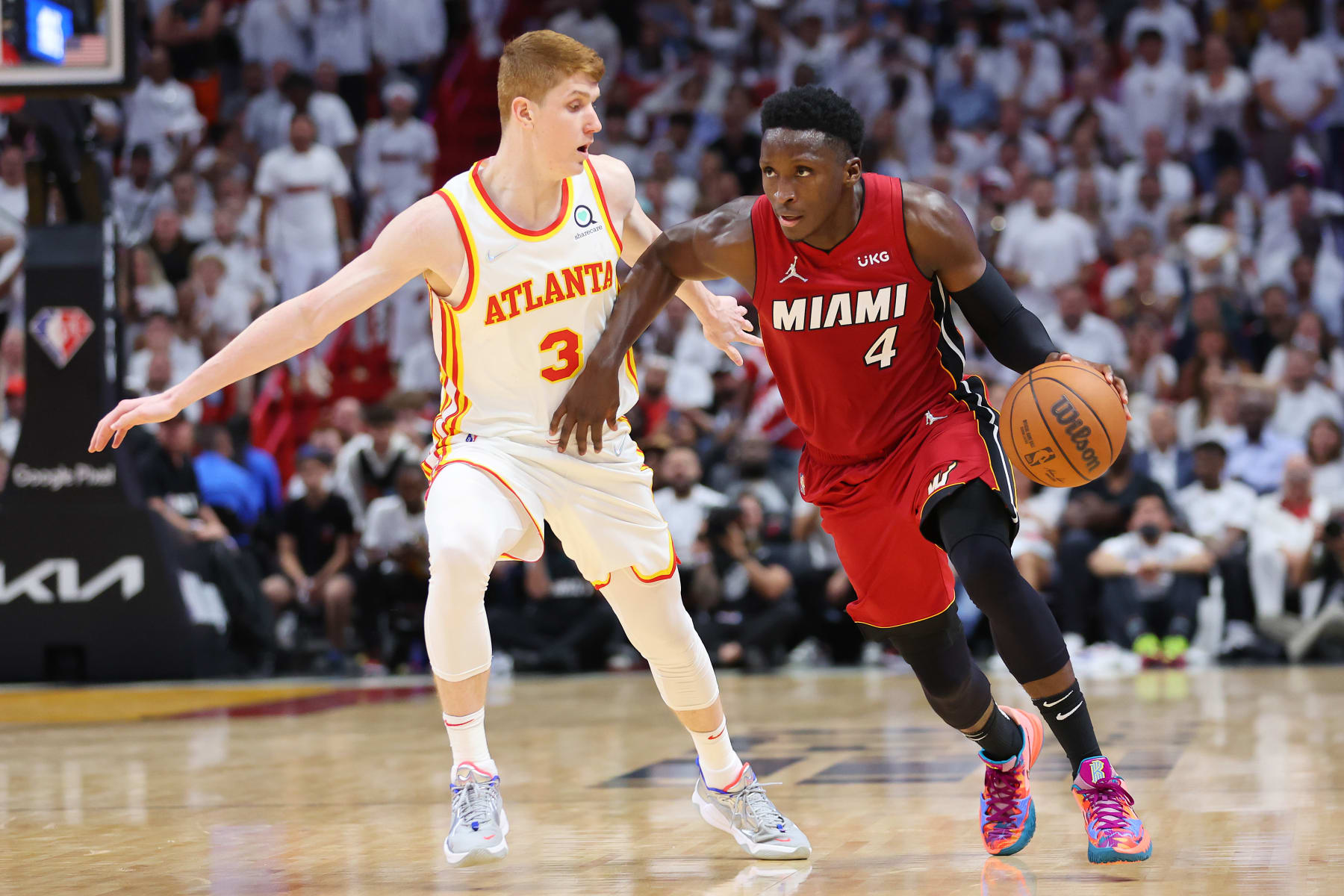 MIAMI, FLORIDA - APRIL 26: Victor Oladipo #4 of the Miami Heat drives to the basket against Kevin Huerter #3 of the Atlanta Hawks in Game Five of the Eastern Conference First Round at FTX Arena on April 26, 2022 in Miami, Florida. NOTE TO USER: User expressly acknowledges and agrees that, by downloading and or using this photograph, User is consenting to the terms and conditions of the Getty Images License Agreement.  (Photo by Michael Reaves/Getty Images)