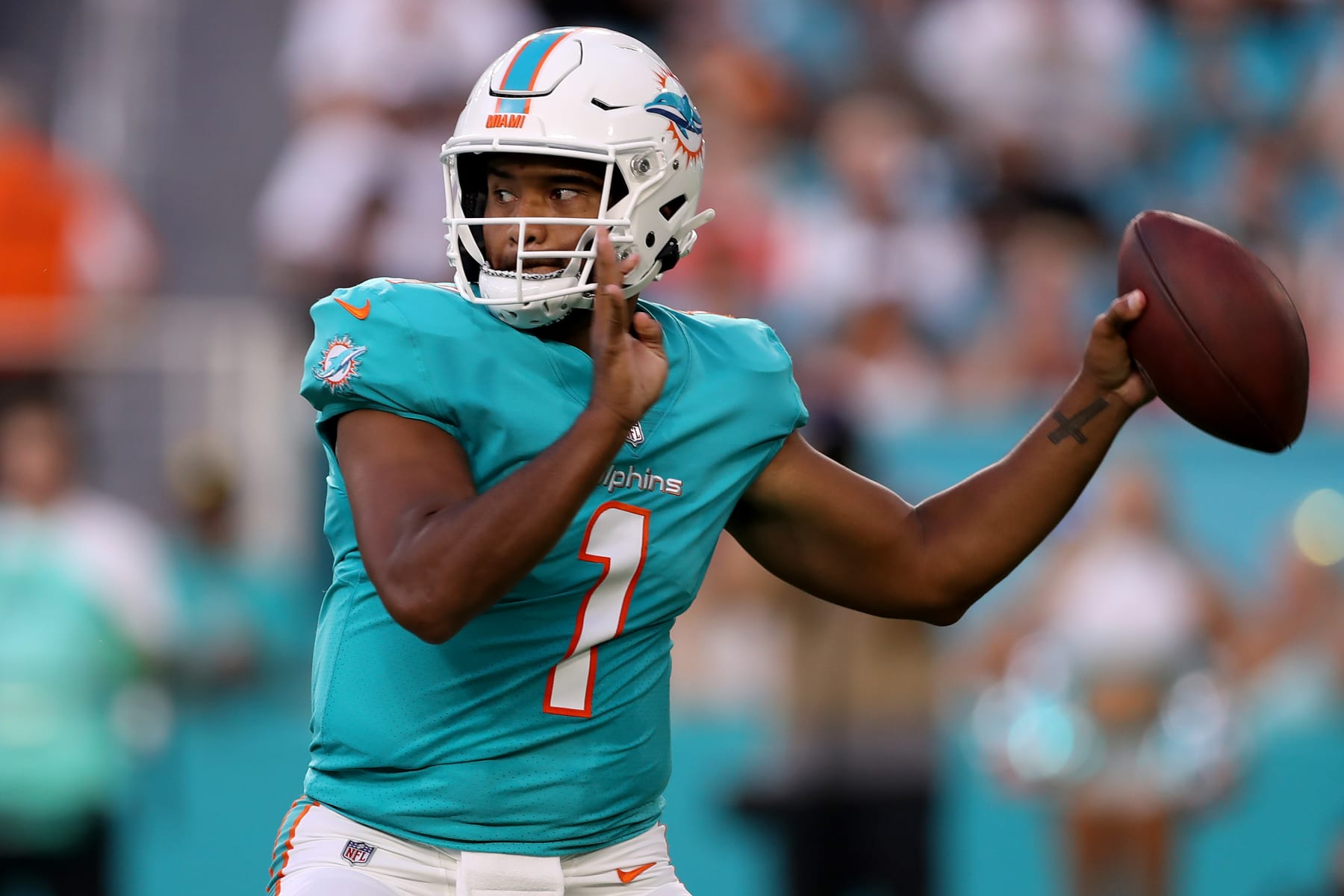 MIAMI GARDENS, FLORIDA - AUGUST 20: Tua Tagovailoa #1 of the Miami Dolphins throws a pass during the first quarter against the Las Vegas Raiders at Hard Rock Stadium on August 20, 2022 in Miami Gardens, Florida. (Photo by Megan Briggs/Getty Images)
