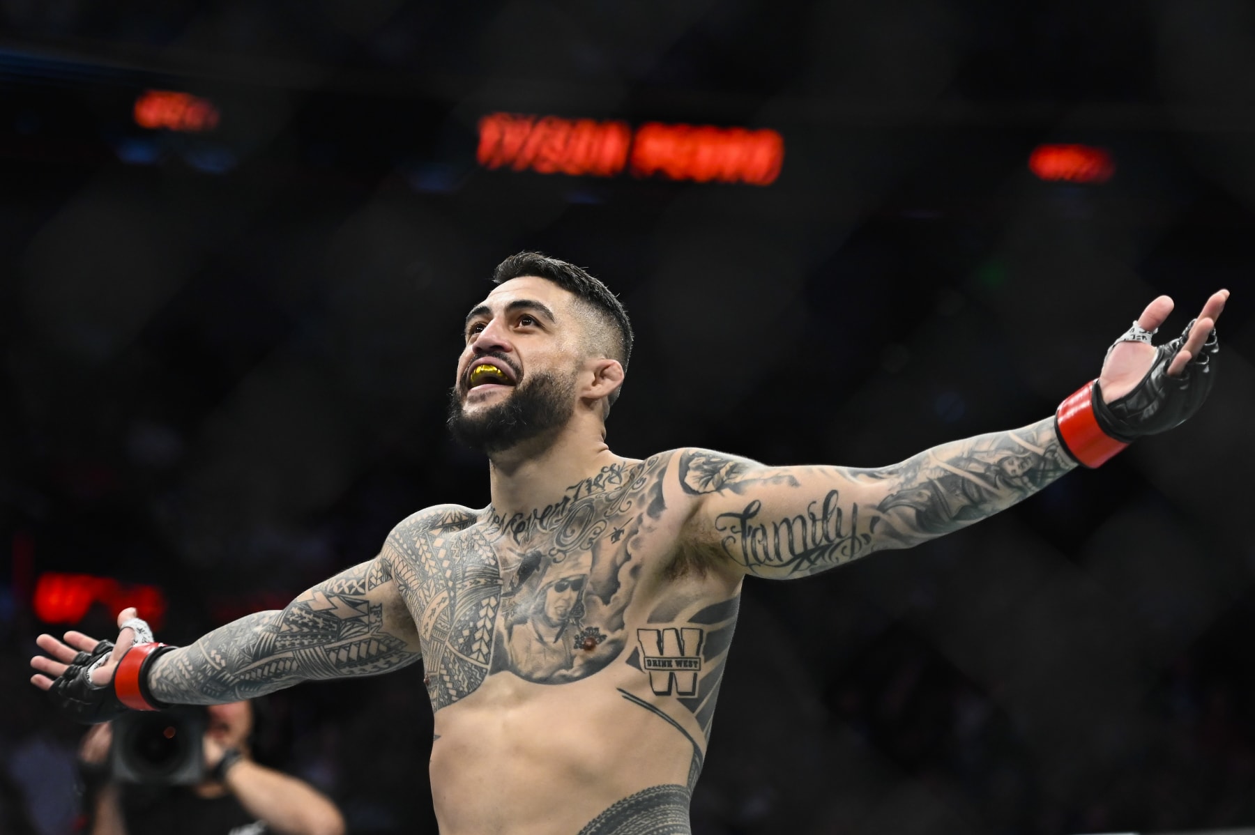 SALT LAKE CITY, UTAH - AUGUST 20: Tyson Pedro of Australia celebrates after defeating Harry Hunsucker of the United States in a light heavyweight bout during UFC 278 at Vivint Arena on August 20, 2022 in Salt Lake City, Utah. (Photo by Alex Goodlett/Getty Images)