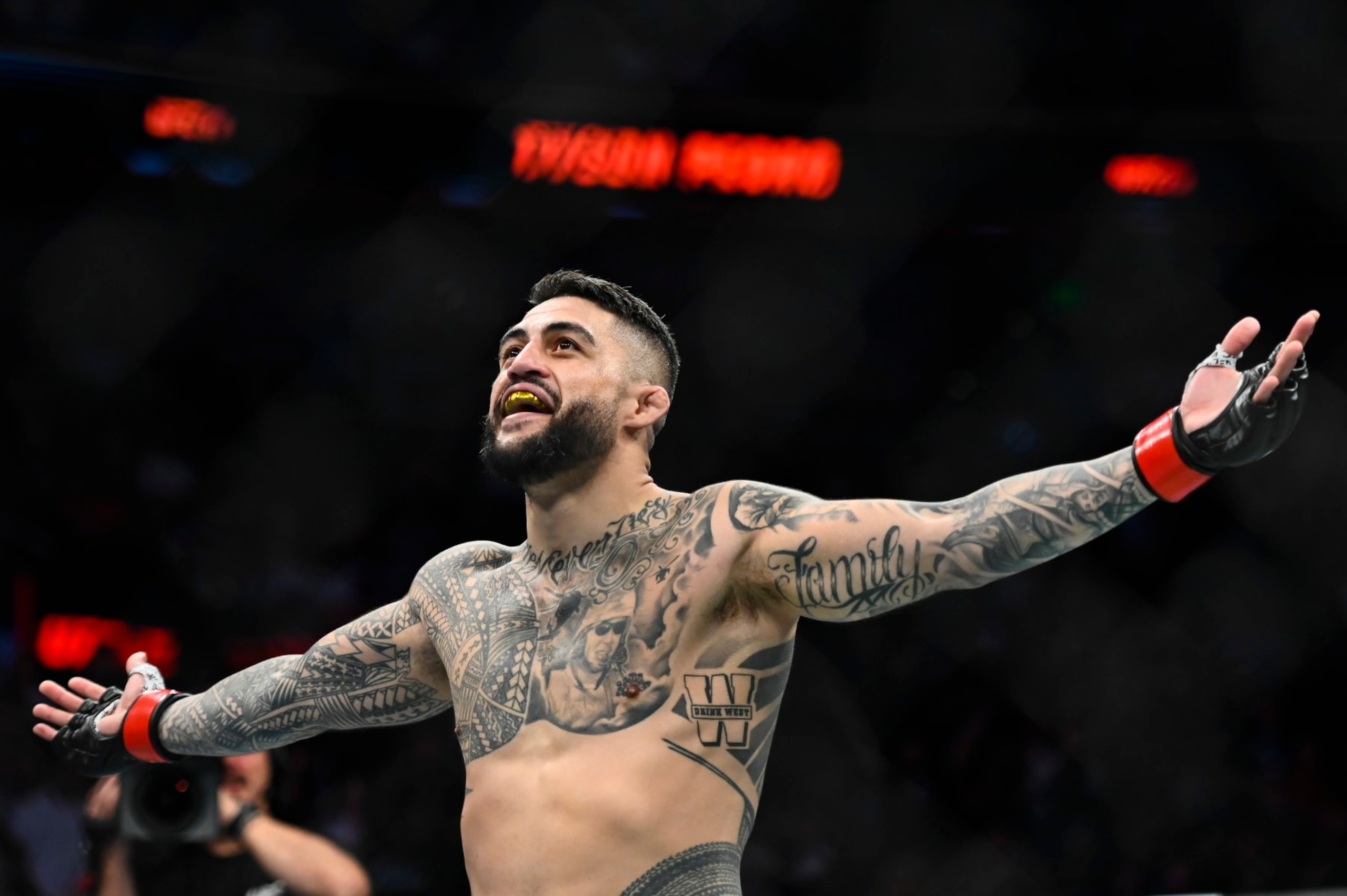 SALT LAKE CITY, UTAH - AUGUST 20: Tyson Pedro of Australia celebrates after defeating Harry Hunsucker of the United States in a light heavyweight bout during UFC 278 at Vivint Arena on August 20, 2022 in Salt Lake City, Utah. (Photo by Alex Goodlett/Getty Images)