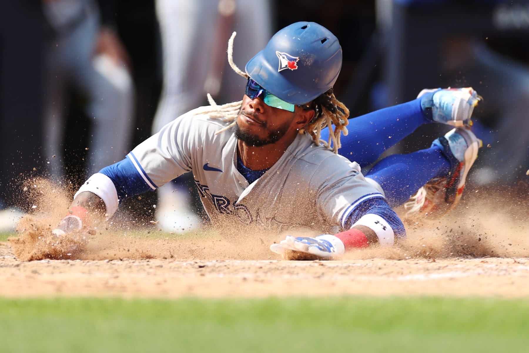 NEW YORK, NEW YORK - AUGUST 20: Raimel Tapia #15 of the Toronto Blue Jays slides into home on a 2-RBI double hit by Alejandro Kirk #30 (not pictured) during the fifth inning against the New York Yankees at Yankee Stadium on August 20, 2022 in the Bronx borough of New York City. (Photo by Sarah Stier/Getty Images)