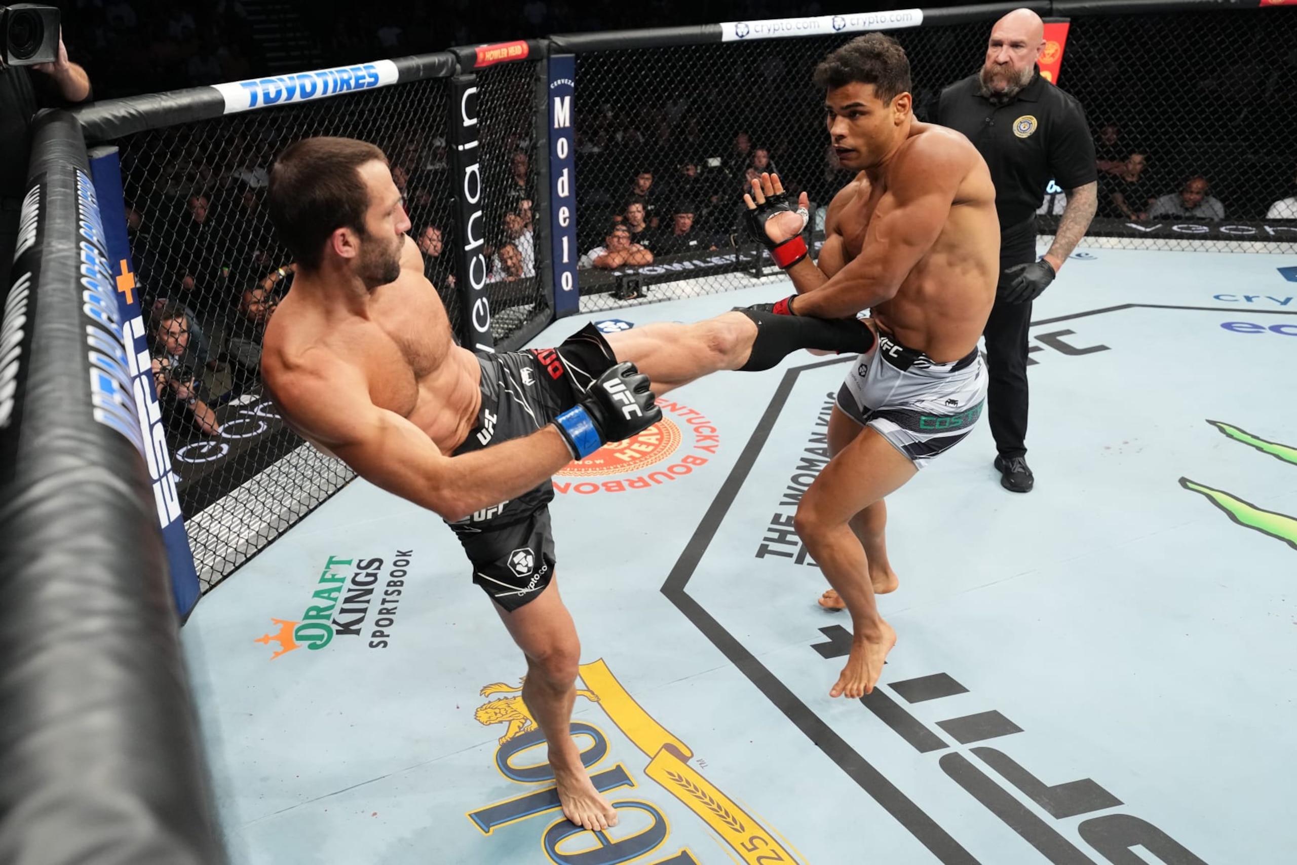 SALT LAKE CITY, UTAH - AUGUST 20: (L-R) Luke Rockhold kicks Paulo Costa of Brazil in a middleweight fight during the UFC 278 event at Vivint Arena on August 20, 2022 in Salt Lake City, Utah. (Photo by Josh Hedges/Zuffa LLC)
