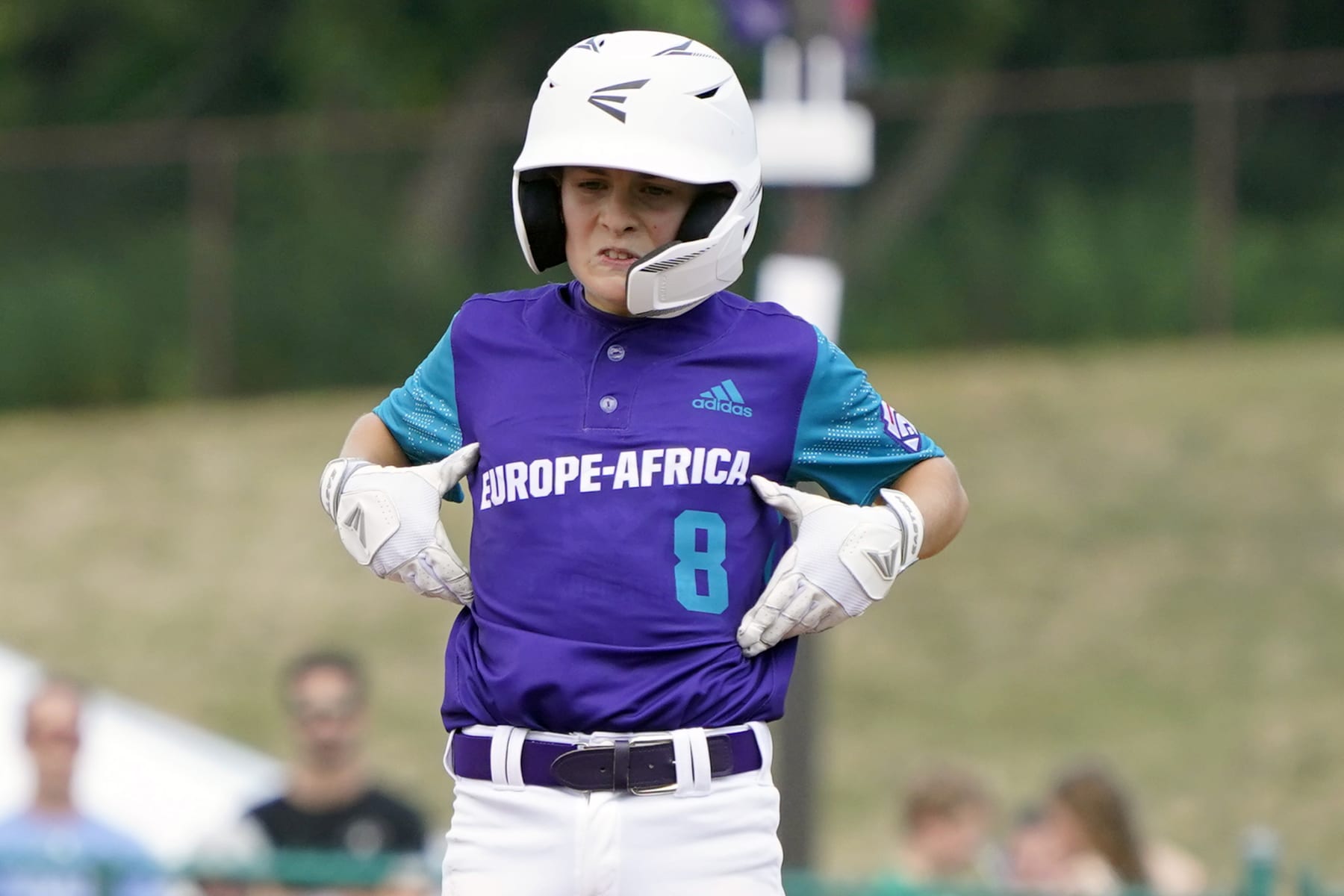 Italy's Francesco Carlini (8) celebrates on second base after driving in a run against Australia during the third inning of a baseball game at the Little League World Series tournament in South Williamsport, Pa., Saturday, Aug. 20, 2022. (AP Photo/Tom E. Puskar)