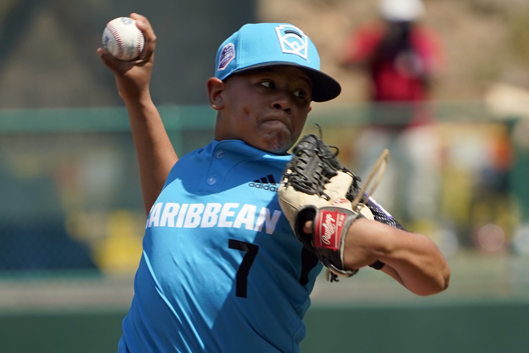 Curacao's Jay-Dlynn Wiel (7) delivers a pitch against Panama during the third inning of a baseball game at the Little League World Series tournament in South Williamsport, Pa., Friday, Aug. 19, 2022. Panama won the game 9-3. (AP Photo/Tom E. Puskar)
