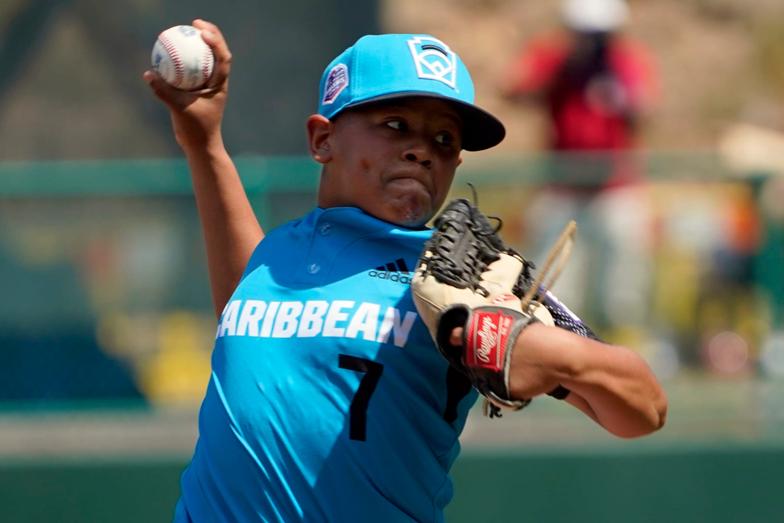 Curacao's Jay-Dlynn Wiel (7) delivers a pitch against Panama during the third inning of a baseball game at the Little League World Series tournament in South Williamsport, Pa., Friday, Aug. 19, 2022. Panama won the game 9-3. (AP Photo/Tom E. Puskar)