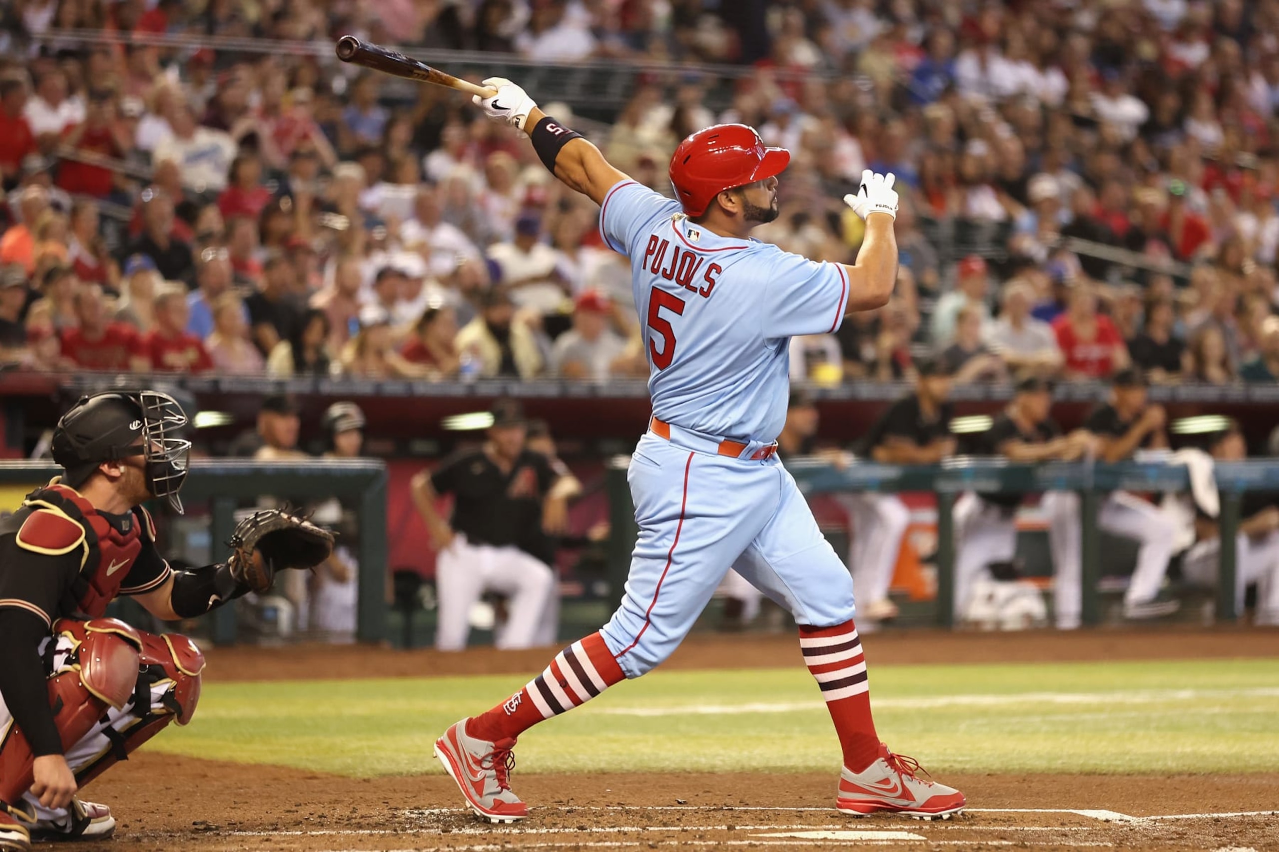 PHOENIX, ARIZONA - AUGUST 20: Albert Pujols #5 of the St. Louis Cardinals hits a solo home run against the Arizona Diamondbacks during the second inning of the MLB game at Chase Field on August 20, 2022 in Phoenix, Arizona. (Photo by Christian Petersen/Getty Images)