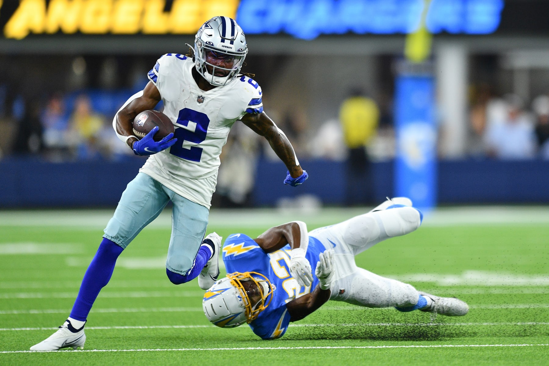 INGLEWOOD, CA - AUGUST 20: Dallas Cowboys wide receiver KaVontae Turpin (2) runs past Los Angeles Chargers safety JT Woods (22) during the NFL preseason game between the Dallas Cowboys and the Los Angeles Chargers on August 20, 2022, at SoFi Stadium in Inglewood, CA. (Photo by Brian Rothmuller/Icon Sportswire via Getty Images)