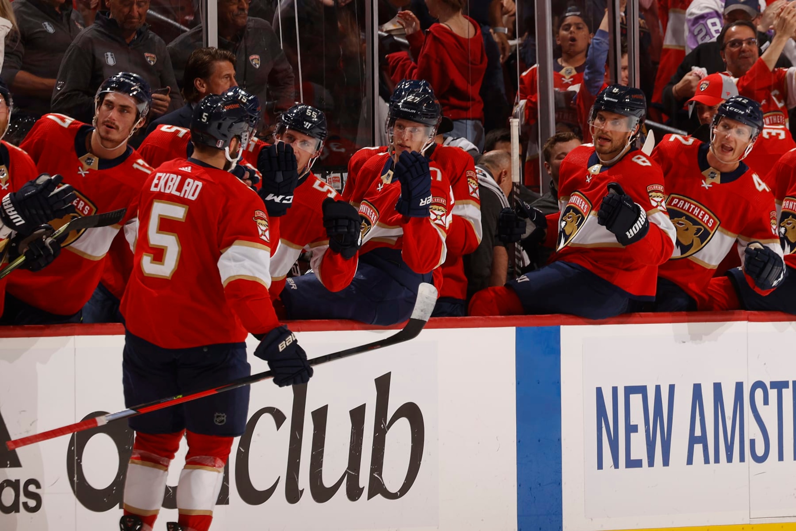 SUNRISE, FL - MAY 5: Teammates congratulate Aaron Ekblad #5 of the Florida Panthers after he scored a first period goal against the Washington Capitals in Game Two of the First Round of the 2022 NHL Stanley Cup Playoffs at the FLA Live Arena on May 5, 2022 in Sunrise, Florida. (Photo by Joel Auerbach/Getty Images)