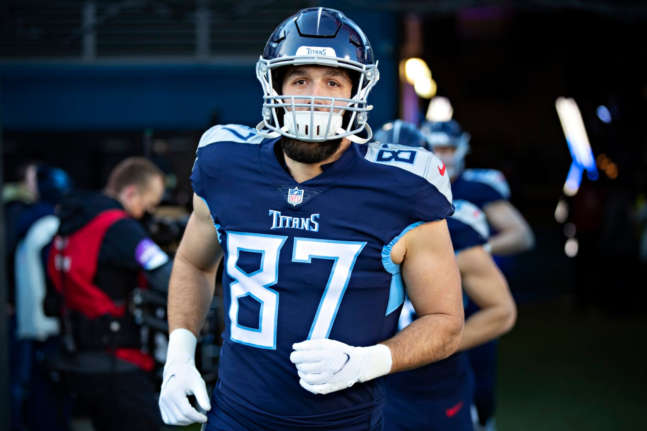 NASHVILLE, TENNESSEE - JANUARY 22: Geoff Swaim #87 of the Tennessee Titans runs onto the field before a game against the Cincinnati Bengals in the AFC Divisional Playoff game at Nissan Stadium on January 22, 2022 in Nashville, Tennessee. The Bengals defeated the Titans 19-16. (Photo by Wesley Hitt/Getty Images) NASHVILLE, TENNESSEE - JANUARY 22: Geoff Swaim #87 of the Tennessee Titans runs onto the field before a game against the Cincinnati Bengals in the AFC Divisional Playoff game at Nissan Stadium on January 22, 2022 in Nashville, Tennessee. The Bengals defeated the Titans 19-16. (Photo by Wesley Hitt/Getty Images)